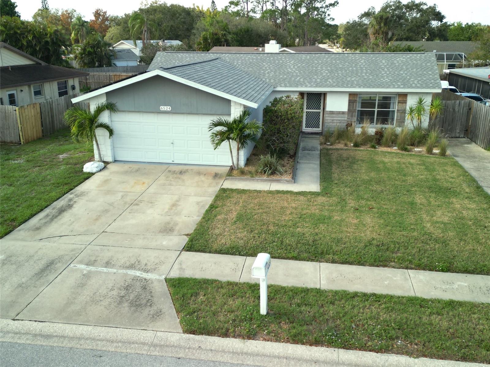 Light and bright Lake Sarasota Home has two bedrooms, large living room, screened lanai, fenced back yard, two car garage, newer roof, tile floors, drive space, two bathrooms and solar lowers electric bills to be very low, the last tenant paid $40-$80 per month. Convenient location near I-75, schools, dog park, beaches, shopping, and downtown. Available now! Dogs ok on a case by case basis. No deed restrictions. High quality schools and a walkable neighborhood.