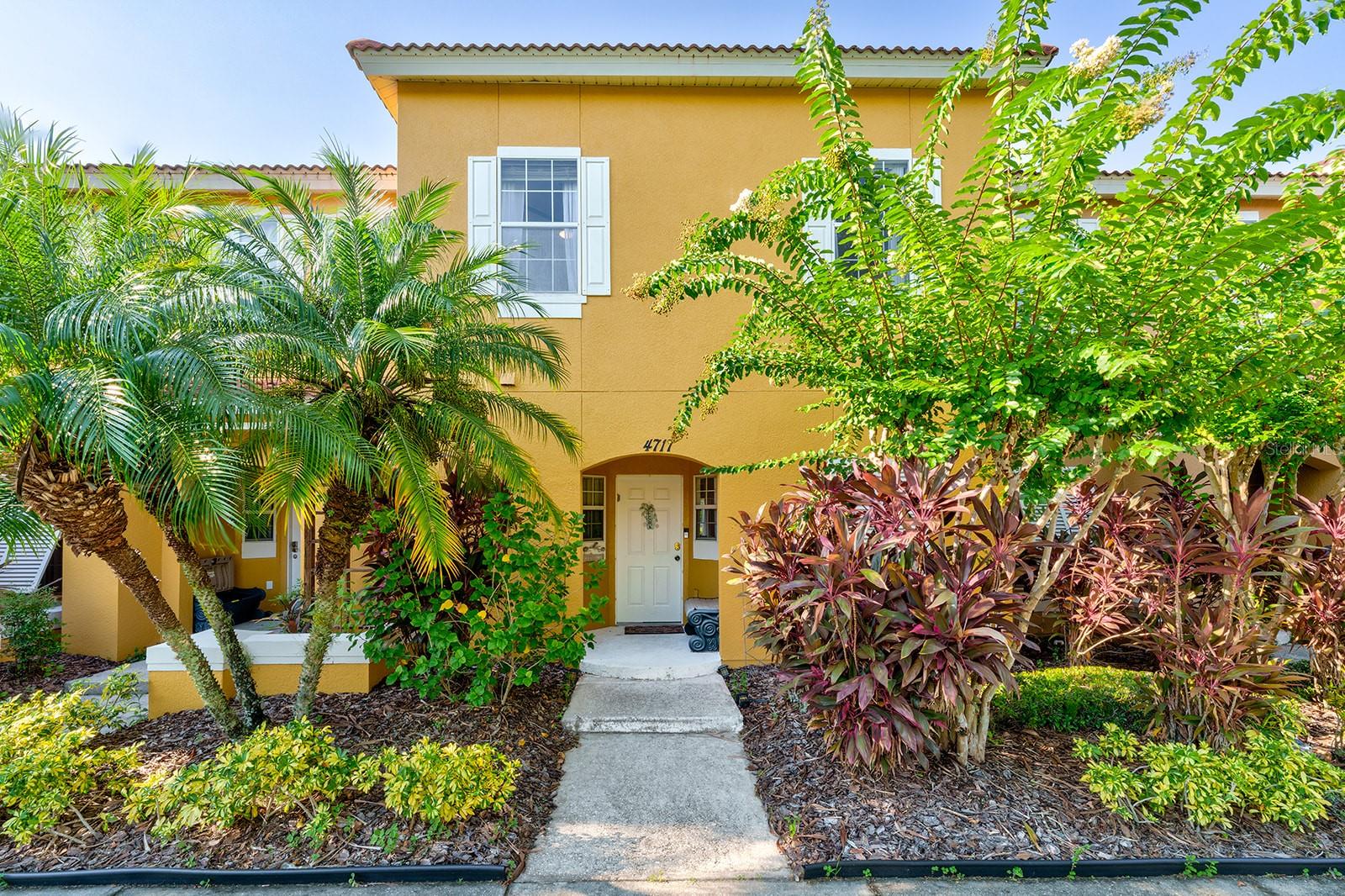 Amenities amenities amenities! Stunning home in the immaculate Terra Verde Resort. This modern and practical town home has a beautiful courtyard with the perfect lake view. Three up stairs bedrooms save space downstairs for the open concept living room dining room with upgraded vinyl flooring. This bright, airy space just feels happy and homely! There is a large primary bedroom with ensuite, and a shared family bath alongside the other two neat bedrooms. The location of the townhome is perfect, just a short scenic walk by the lakeside, lands you right at the club house and huge heated community pool. Also, for those quiet nights when you're needing to unwind from a busy day in the parks, a dip in your own private hot tub may appeal more. With club house, gym, movie theater, heated pool, bar, volley ball, mini golf and bass loaded ponds it's hard to decide what to head too first! From the Guard at the gate to the trash concierge this community provides it all.