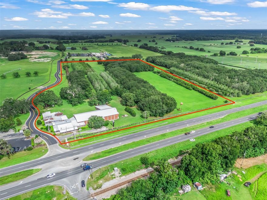 DYNAMITE LOCATION! Prime 21.7+/- Acre Industrial Property for Sale in Summerfield, Florida. This strategically located industrial property in the heart of northern Central Florida with an approved Planned Unit Development (PUD) zoning for a wide variety of uses. Situated between key commercial hubs such as I-75, the Florida Turnpike, The Villages, Lady Lake, and Ocala, this property is ideally positioned for manufacturing, warehousing, distribution, contractor yards, and other industrial uses. The proximity to major transportation routes ensures easy access for logistics and operations, with the Florida Turnpike, I-75, and Highway 44 interchange only 15 minutes away. Approved Zoning for Diverse Uses. The zoning allows for: Manufacturing facilities, Warehousing and distribution, Contractor yards, (retail/wholesale), Plant nurseries, Processing of products produced on-site, Cardroom facilities, Storage of building supplies, equipment, and materials, Open storage areas, Fuel storage, Auto wrecking/junk yards, This flexible zoning makes the property ideal for a range of industries and businesses, and offers the unique advantage of bypassing the often lengthy and costly zoning process that many other properties face. Extensive Development Potential. The property allows for up to 400,000 square feet of gross development, providing ample space to build out facilities for manufacturing, warehousing, or distribution. Whether you are looking to expand an existing business, set up a new operation, or build a large industrial complex, this site offers the space and approved zoning to bring your vision to life. On-Site Infrastructure, Existing Buildings: The property includes a 9,000+/- square foot industrial building previously used for agricultural supplies and storage. This building features air-conditioned office spaces, and can serve as immediate office or operational space as you develop the property. Utilities: Essential utilities such as water and sewer are provided by Marion County Utilities, which is already connected to the site along US Highway 301.  Outstanding Location & Accessibility. Located in an area that is experiencing continuous growth, this property is perfectly positioned to benefit from the ongoing development of Central Florida. The surrounding area offers convenient access to both local and regional markets, with major highways and infrastructure supporting both local and interstate commerce. 15 minutes to the Florida Turnpike, I-75, and Highway 44 interchange. 
Close proximity to The Villages, Lady Lake, and Ocala, providing a large labor pool and nearby services. A Rare Opportunity! Heavy commercial and industrial land is becoming increasingly difficult to find in Florida, and properties with this level of zoning approval are even more rare. This is a unique opportunity to secure a site with the infrastructure, location, and approved zoning necessary to support a wide variety of commercial and industrial operations. This property offers tremendous value for businesses looking to expand, invest, or relocate to a prime industrial location in northern Central Florida. With the zoning already in place and a range of approved uses, this site is ready to accommodate your business needs today. Copy this link for the VIDEO: https://opulent-rem.aryeo.com/videos/0197d5de-a7ca-71b1-9d40-eff717ec0109