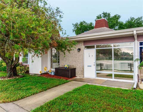 Photo of 4318 Tahitian Gardens Circle #F, Holiday, FL 34691 (MLS # O6429748)