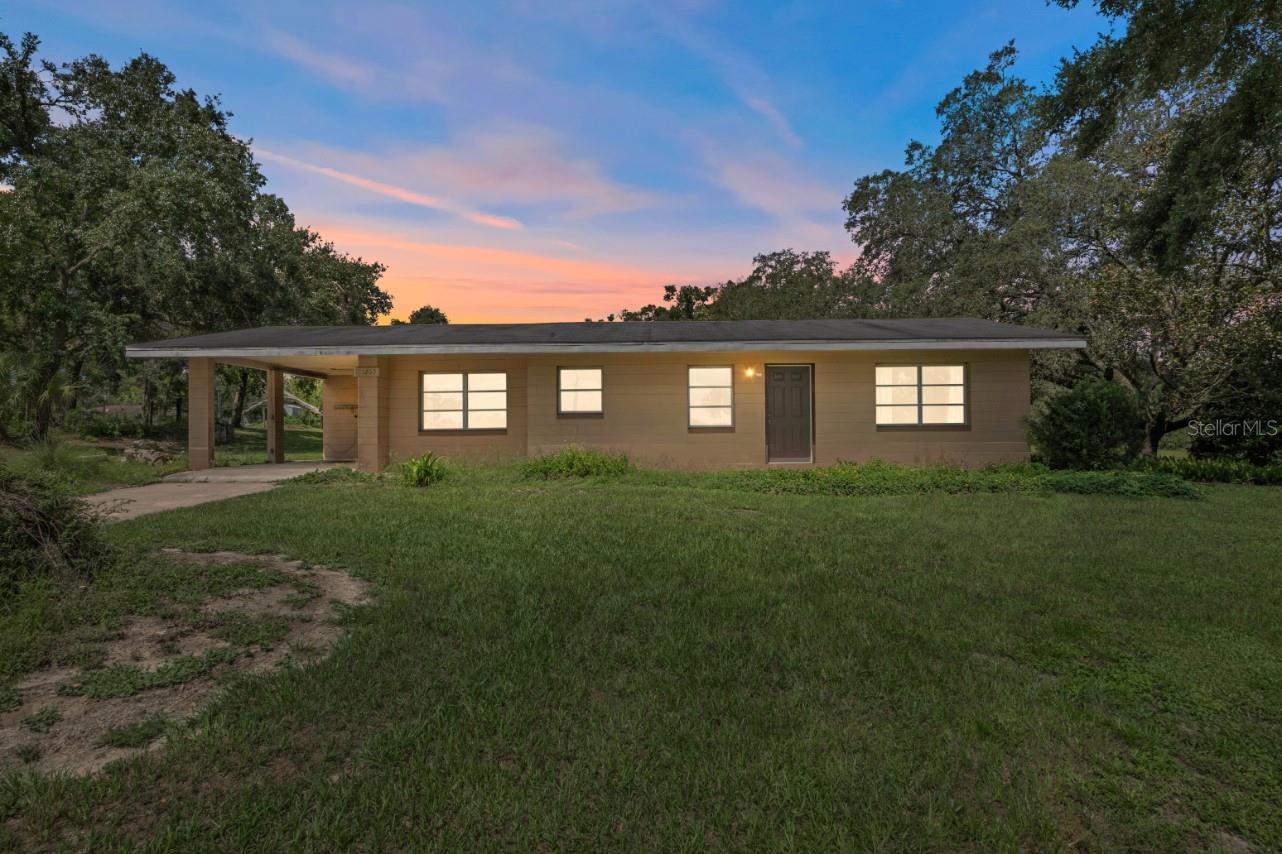 Set on a gorgeous nearly one-acre corner lot, under the shade of mature trees, this 2 bedroom, 1
bath home offers an incredible opportunity to get creative for an excellent potential return on
investment! In addition to the 904 sq ft main home with a 2018 roof, a 2014 AC and 2018 Water
Heater- out back sits a 1,200 sq ft block building with a full bathroom. It was formerly used as an
accessory dwelling unit and currently serves as a workshop. There’s also a second oversized
storage shed on the property, giving you even more space for tools, equipment, or future plans.
Inside the main home, there’s no carpet in sight. The 22x11 living room features crown molding
and connects easily to the kitchen, which sits between the formal dining room and living area.
The kitchen is equipped with a brand-new stainless steel range and refrigerator, plus an existing
stainless steel dishwasher and ceiling fan. A passthrough to the dining room helps keep the floor
plan feeling open and connected, and from there, you’ll find access to both the carport and a
screened-in back porch for added functionality. Both bedrooms are a great size and share a
central bathroom with a walk-in shower. Surrounded by a canopy of trees and nestled in a stellar
location, this property stands out for its potential. Whether you're ready to update the main home
or reimagine both structures to unlock rental income opportunities, this is a smart investment
with room to grow. Call today to explore all the ways this versatile property could work for you!