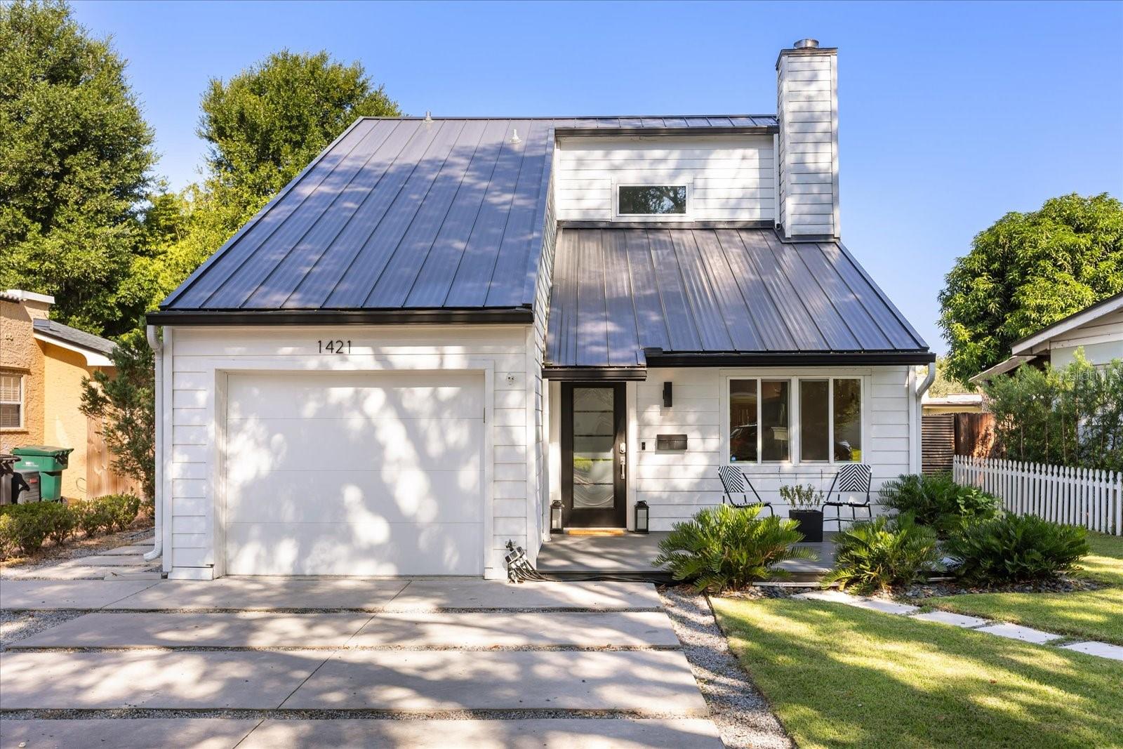 Welcome to 1421 Sunset Drive – A Turnkey Gem in the Heart of Olde Winter Park!
This is a rare opportunity to own a beautifully updated home on one of Olde Winter Park’s most charming, brick-lined, tree-canopied streets. Just steps from serene Lake Knowles and Lake Wilbar, and minutes from the vibrant dining, shopping, and cultural experiences of Park Avenue, this 3-bedroom, 3.5-bathroom residence offers the perfect blend of classic charm and modern convenience. Enjoy a low-maintenance lifestyle with eco-friendly landscaping and a thoughtfully designed floor plan featuring two spacious primary suites — one upstairs and one down — each with its own updated bathroom. Inside, the home boasts tall vaulted ceilings, warm wood plank LVT flooring, a cozy wood-burning fireplace, and multiple inviting living areas. The kitchen is a standout with sleek cabinetry, granite countertops, and stainless steel appliances, ideal for both daily living and entertaining. Step outside to enjoy Trex decking on both front and rear patios, a fenced backyard for privacy, and a convenient laundry/mudroom entry from the garage. Additional highlights include a standing seam metal roof, attached garage, and access to top-rated Winter Park schools. The home is also located near the YMCA, Interlachen Country Club, Winter Park Racquet Club, Rollins College, UCF, and AdventHealth Winter Park.
This home is move-in ready and offers the very best of Winter Park living — schedule your private showing today!