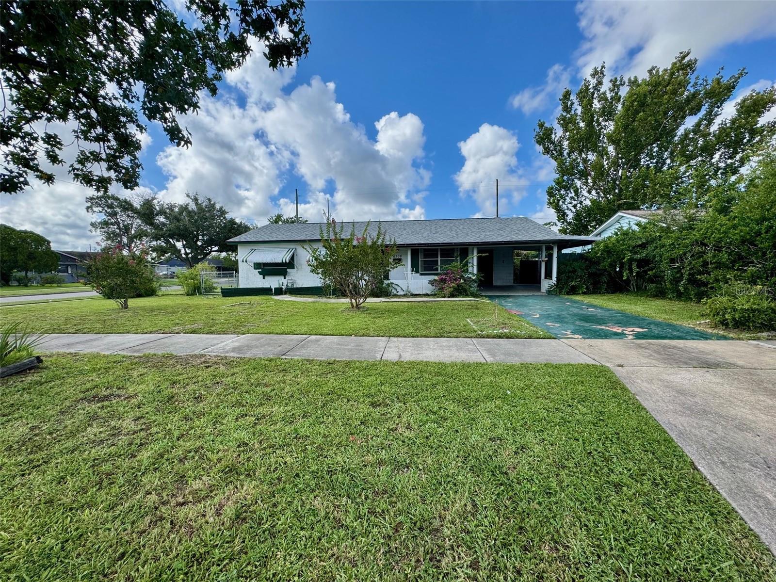 Embrace the chance to create your dream home! This cozy 3-bedroom, 1-bath home sits on a generous .21-acre fenced corner lot (85x110), providing both privacy and outdoor space. With recent updates including new roof (2023), AC (2024), electrical panels (2024), and water heater, this house is ready for your personal touches. Enjoy the comfort of new laminate flooring throughout and unwind on the large screened back porch, ideal for relaxation. This home is perfect for budget-minded individuals seeking a property with great potential. With a some effort, you can build equity and transform this space into something special that you can call your own!! Plus you may also appreciate the peaceful setting and the convenience of parking a work vehicle and/or boat on the property, lots of room for that. Located within easy reach of highways, schools, public transport, and the airport, the Englewood Community emphasizes both convenience and affordability. Explore the potential and envision the possibilities that await you!