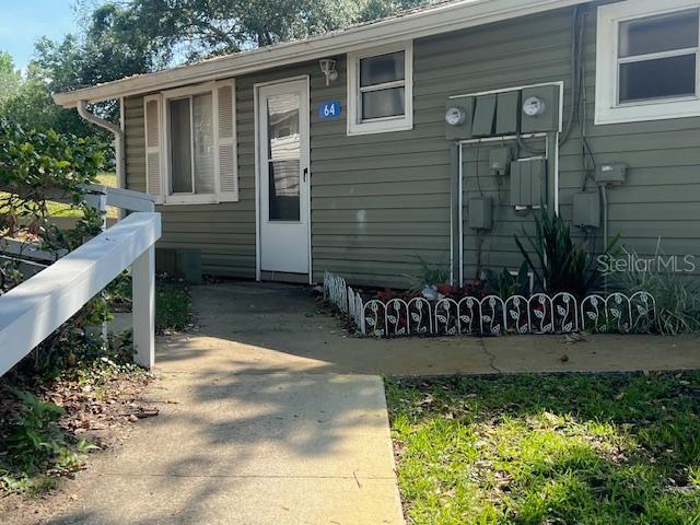 Vacation Village isn't just a place to live; it's a lifestyle. Residents enjoy access to Lake Louisa and the Clermont Chain of Lakes, complete with a boat ramp, fishing pier, and private beach. The community's amenities are impressive, including a recreation center, heated pool, sports courts, a playground, as well as RV and trailer parking. Enjoy this renovated charming 2-bedroom, 1-bathroom villa nestled in the gated, resort-like community of Vacation Village. Huge screened room with no rear neighbors which could be encosed for additional square footage or enjoy as it is. Location is key, and this home is ideally situated close to Orlando's famous theme parks, Lakeridge Winery, and moments away from Historic Downtown Clermont. Shopping, dining, and entertainment options are right around the corner. Plus, the future Olympus Park, with its multi-sports facility, retail, and a professional sports arena, will be just down the road. Whether you're looking for a move-in ready primary residence, a vacation home, or a smart investment, you don't want to miss this one. The HOA covers numerous services, including Cable TV, internet, pest control, and more, along with all of the property amenities, a truly maintenance-free living experience.