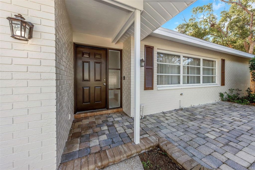 Photo of 1495 Lakeside Drive, Dunedin, FL 34698 (MLS # TB8466148)