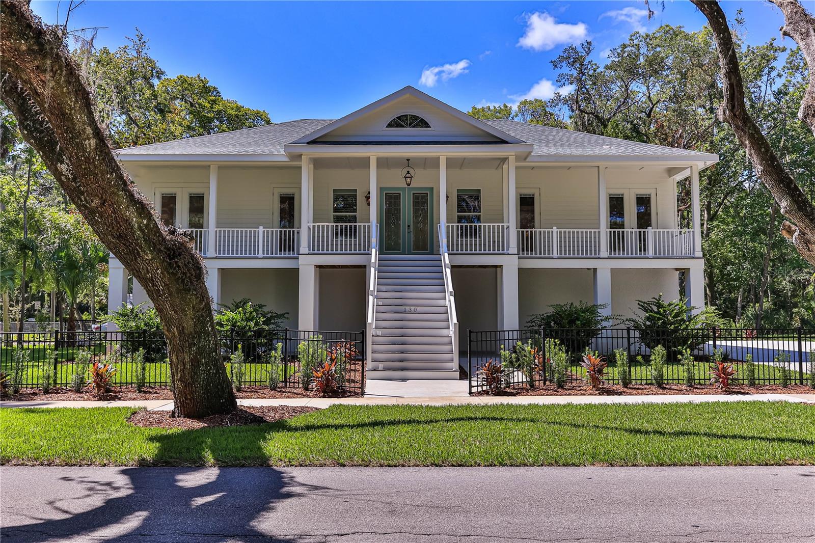 This one is special! Brand new luxury home located in historic downtown Crystal River. On beautiful Crystal Street, lined with hundred year old live Oaks, this is the latest very desirable home built by Citrus Builder. In the city CRA, right next to the historic train depot, and the Three Sisters Springs cross town walking trail, this is an amazing property. True southern elegance, with all the latest modern amenities. The home is elevated and well above the floodplain with a cargo lift, and absolutely gorgeous! Huge front porch overlooking the oak trees, real natural Gas lanterns on the front porch, quartz Cambria countertops throughout, and the list goes on. Huge garage and storage area under the home. Everything you see in the pictures is included. All upgrades, designer light and plumbing fixtures, fireplace, Samsung Frame television, stainless steel gas appliances, tankless gas water heater and all furniture and decorations are included! Designed and decorated by a professional design consultant. Smart home; features include doorbell camera, door locks, lighting control, garage door, and AC thermostat control all from your phone, computer, or Alexa voice command. Meticulous details throughout, 10 and 12 foot ceilings, quadruple layer crown moldings, beautiful woodwork, every closet has custom built-ins, custom built laundry mud room. Trex composite decking, PVC railings, high efficient spray foam insulation and so much more. You have to see it all to believe it.
A true turnkey masterpiece, in an amazing neighborhood. In the CRA, the property has unlimited potential; multiple allowable uses, residential, commercial, multi-family, and the size to expand and build other structures on the property. Walk and golf cart to your favorite restaurant and store, and enjoy the beauty of historic Crystal River, from a stunning brand new modern structure. An amazing opportunity!