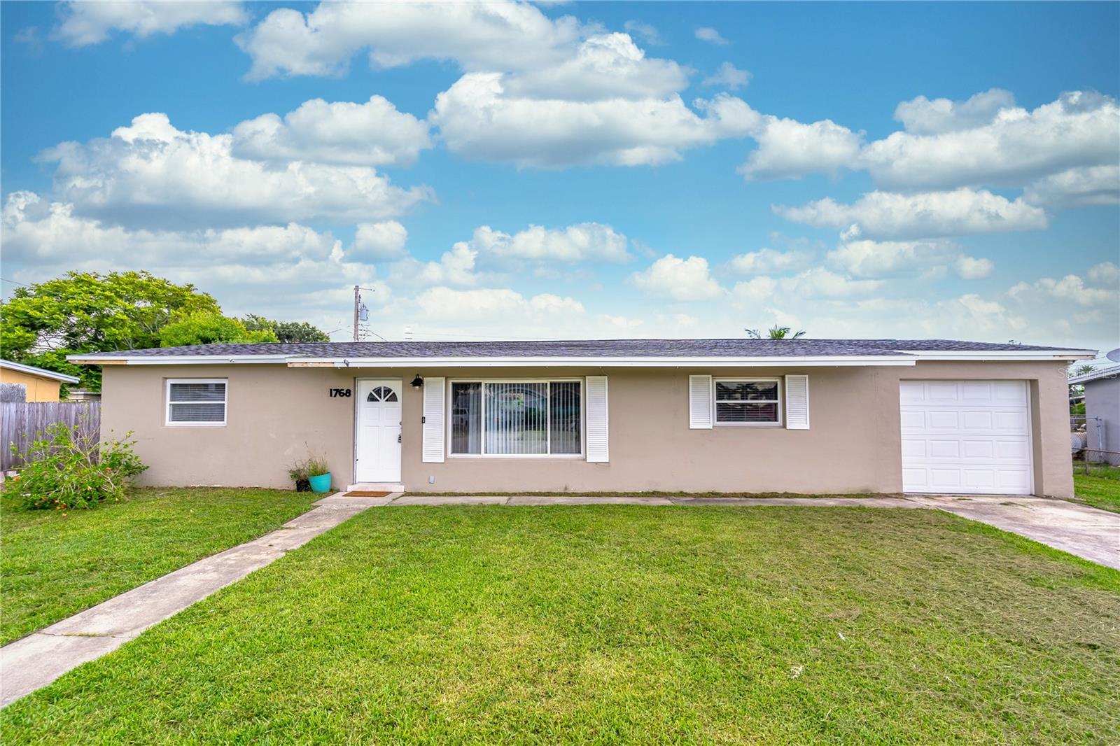 Charming Melbourne Block Home – JUST MINUTES TO THE BEACH! Located in an established Melbourne neighborhood just 2 miles from the Intracoastal and less than 5 miles to the sparkling shores of Florida’s East Coast, this traditional BLOCK STYLE HOME offers the ideal blend of convenience, comfort, and coastal living. Whether you're a first-time homebuyer or looking to downsize, this ONE LEVEL GEM has so much potential. Inside, you'll find a smart SPLIT FLOOR PLAN that provides privacy and function. The primary suite with ATTACHED BATH sits to the right, while two additional bedrooms and a full bath are on the left, separated by a spacious living and dining area at the heart of the home. The UPDATED KITCHEN features GRANITE countertops, SOLID WOOD CABINETRY, and a thoughtful extension perfect for a breakfast nook, office, or drop zone. A DEDICATED LAUNDRY ROOM is conveniently located just off the kitchen. Enjoy year-round relaxation in the BONUS ROOM—an ADDITIONAL 250 SQUARE FEET OF LIVING SPACE with views out back to the fenced backyard and direct access to a COVERED PATIO, ideal for outdoor dining or entertaining. Situated close to shopping and dining, you'll find a Walmart Supercenter just 1.9 miles away and the Melbourne Square Mall only 5 miles down the road. Don’t miss your chance to own a home with great bones, updated kitchen, and incredible proximity to everything Melbourne has to offer—including the beach!