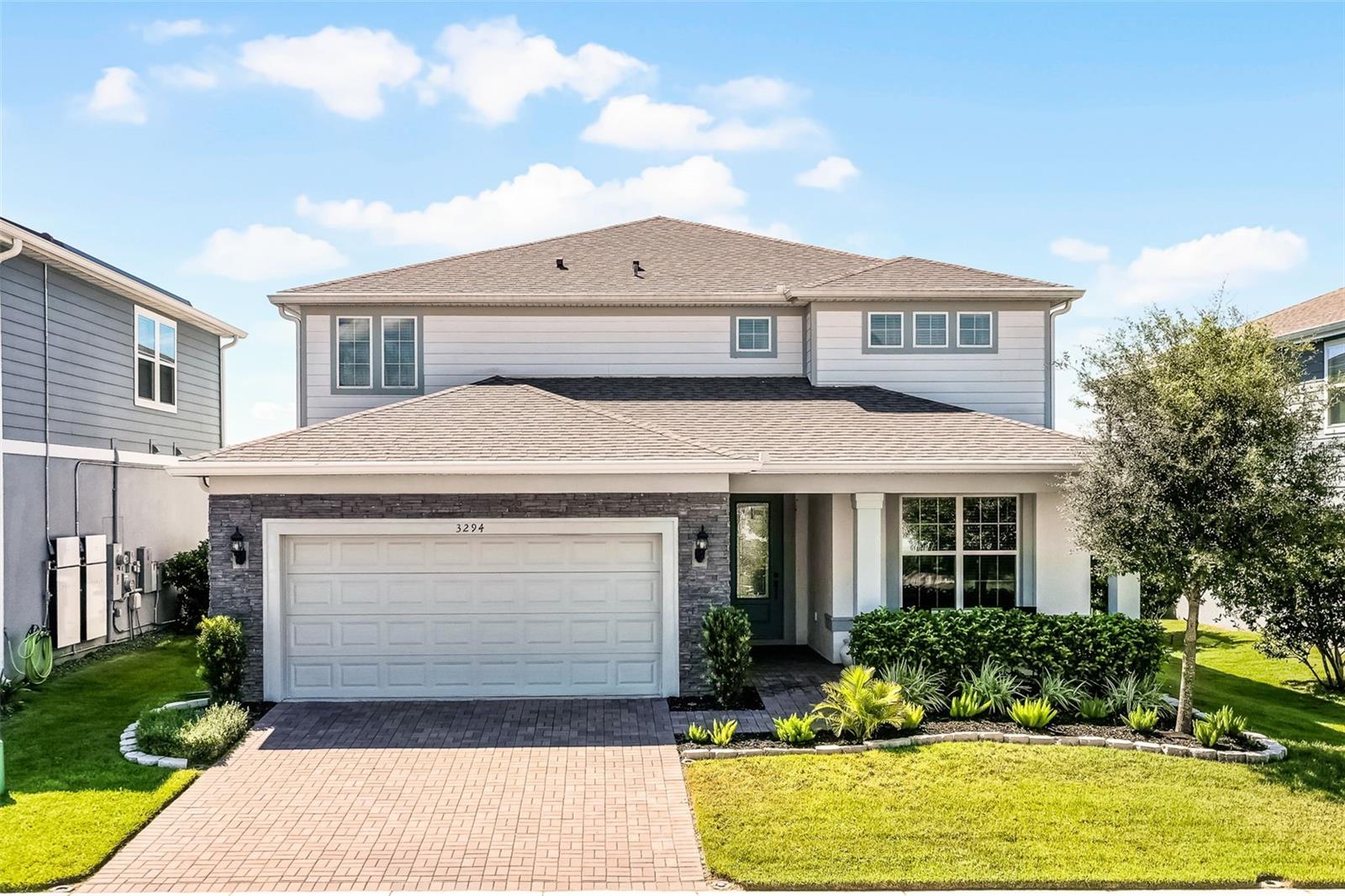 Step into this stunning two-story home in the popular gated community of Lakeview Preserve, where elegance meets functionality. Sitting on a larger homesite with a 4-foot garage extension, EV car charger, and beautiful stone-accented exterior, this home is as striking on the outside as it is inside. The Yorkshire floorplan by Pulte Homes offers 5 spacious bedrooms, 4.5 bathrooms, a large upstairs loft, and a versatile flex space—made private by French doors—perfect for a home office, gym, or library. Ideal for those seeking a multigenerational living concept, it features a first-floor ensuite for guests with a private bath, separated from the upstairs bedrooms and luxurious primary suite.
Inside, wood-tone LVP flooring flows throughout the first-floor main living areas, complemented by custom trim work, designer wallpaper, and contrasting doors and trim. The gourmet kitchen is a showstopper with contrasting upper and lower cabinets, upgraded hardware, a large island with pendant lighting, a gorgeous backsplash, and premium finishes. The expansive great room opens with triple sliders plus additional double sliders to the covered lanai—perfect for indoor-outdoor living—with no rear neighbor for added privacy.
Lakeview Preserve offers an incredible lifestyle with a resort-style pool, fitness center, clubhouse, playground, green space, and more—all just minutes from Winter Garden and Clermont’s best shopping, dining, and attractions.
Not only is this home priced to sell, but the sellers are also offering a $20,000 closing cost contribution—making it even more attainable! Bonus: a VA assumable loan is available! Opportunities like this are rare—see it in person and fall in love with every detail. Call today to schedule your private tour and make this dream home yours! WELCOME HOME!