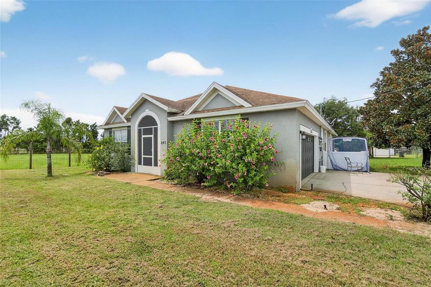 RARE FIND – TWO SINGLE-FAMILY HOMES ON OVER AN ACRE! This unique property in Lake Wales offers the perfect setup for a large multi-generational family, in-law suite, or an excellent income-producing rental opportunity. The fully fenced lot is dotted with fruit trees and provides privacy and space to enjoy. (Home in front (4/2) is now going completely repainted and carpets cleaned)

The main home features 4 bedrooms, 2 bathrooms, and 2,170 sq. ft. of updated living space, including fresh interior paint, new flooring in the main living areas, a spacious eat-in kitchen, and a large great room with combined dining and living areas. Step out to the screened back patio and take in the peaceful yard.

The guest home, built in 2016, offers 3 bedrooms, 2 bathrooms, and 1,300 sq. ft. of heated living space. Highlights include an updated kitchen and baths, a large open kitchen-to-living layout, inside utility, 2-car garage, and screened patio. This second home also has its own private driveway and fencing, making it ideal as a rental or in-law residence.

Don’t miss this rare opportunity—two move-in ready homes on one beautiful property with endless possibilities!