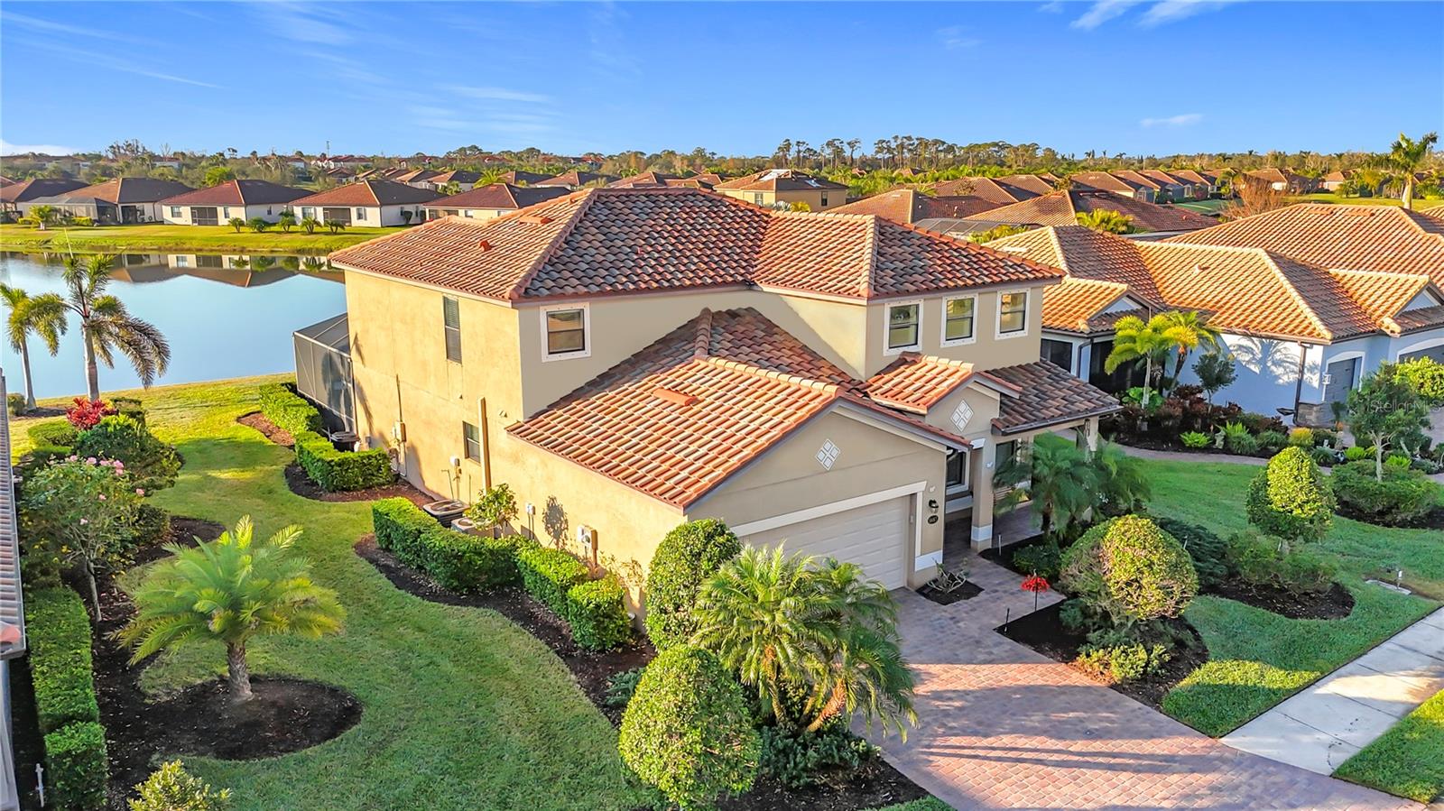 Live the Resort Lifestyle Every Day in River Strand Golf and Country Club!
Welcome to the exclusive, gated community, where luxury living meets unparalleled amenities in one of Bradenton’s most sought-after neighborhoods. This stunning waterfront home offers more than just four bedrooms, three full bathrooms, and two rare half baths—it’s your gateway to a vibrant, active lifestyle filled with premium amenities and everyday comfort.
Step into 2,884 square feet of beautifully designed living space, where soaring ceilings, elegant crown molding, and solid surface countertops create an upscale atmosphere perfect for entertaining or relaxing. The thoughtfully designed floor plan includes a spacious primary suite on the main level with a spa-like bathroom and walk-in closet, while upstairs offers three additional bedrooms, a Jack-and-Jill bath, and a versatile bonus room ideal for a home office, media room, or play space. Every bedroom in the home features a walk-in closet and there are TWO walk-in closets in the Primary Bedroom.
This home also features a private heated pool and spa with a screened lanai and covered patio, ideal for enjoying Florida’s year-round sunshine and outdoor living. The chef’s kitchen is complete with granite countertops, a walk-in pantry, modern appliances, and plenty of space for gathering. You'll also appreciate the extra storage throughout the home, including a large closet under the stairs and an additional kitchen closet perfect for storing countertop appliances.
But what truly sets this home apart is the lifestyle that comes with it. Living in River Strand means you’ll enjoy access to two state-of-the-art fitness centers, Har-Tru tennis courts, and vibrant pickleball facilities. The resort-style pools, complete with a lazy river, is the perfect way to unwind. Social life thrives here, with a full calendar of community events including group fitness classes, live entertainment, biking groups, and more. The clubhouse features both casual and upscale dining options, plus a poolside Tiki Bar for relaxed evenings with friends and neighbors. Additional community perks include a library, walking paths, and on-site golf and tennis pro shops.
The home itself also includes hurricane shutters, an irrigation system, and a spacious two-car garage. Designed in classic Mediterranean style with tile roofing and charming curb appeal, it offers a rare combination of elegance, function, and fun. Includes landscaping, internet and cable, 24/7 security, 24/7 gym access, and much more!
With its private pool, beautiful finishes, and full access to world-class amenities, this home is your opportunity to enjoy resort-style living every day in one of the area’s most desirable communities.