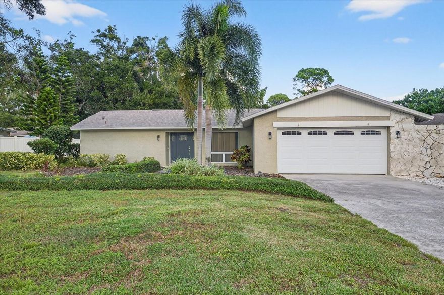 Welcome to 775 Wild Oak Lane, a meticulously maintained and beautiful home tucked away on a quiet, tree-lined street in one of Palm Harbor’s most desirable neighborhoods, Westlake Village. This 3-bedroom, 2-bathroom residence blends timeless charm with thoughtful updates, offering the perfect balance of comfort and style.
Step inside to discover a bright and inviting split floor plan anchored by a warm and comforting family room with a wood-burning fireplace off the kitchen, the ideal spot to curl up with a good book or gather with loved ones. The kitchen sits at the heart of the home, featuring solid wood cabinetry, granite countertops, and newer stainless steel appliances.
The oversized primary suite offers a private retreat with a renovated ensuite bathroom and a custom organized walk-in closet. Two spacious guest bedrooms on the opposite side of the home provide ample storage and privacy for family or guests. 
A true highlight of the property is the versatile 500-square-foot bonus room. Originally a sunroom, now fully finished with ceramic tile, air conditioning, and two French doors leading to the backyard. This space also has a built-in beverage station with cabinetry and a beverage fridge that will stay with the home. This oversized, bright,  flexible space is perfect for large gatherings and family movie nights. 
Outside, enjoy your own backyard oasis with mature landscaping, a custom grilling area, and a covered gazebo, ideal for relaxing afternoons or peaceful evenings. Recent updates include a new roof (2020), hurricane-rated windows (2020-2023), fresh interior paint (2025), updated luxury vinyl flooring, and a tankless hot water heater.
Living in Westlake Village means more than just a beautiful home, it’s a true community lifestyle. The low yearly HOA offers excellent amenities including a large pool, clubhouse, park, playground, and tennis courts, all within a golf cart-friendly neighborhood lined with shady sidewalks for endless walks.
Perfectly situated near Honeymoon Island State Park, the Dunedin Causeway, the Pinellas Trail, top-rated schools, and the YMCA, this home puts you minutes from Palm Harbor’s best beaches, recreation, and local downtown Palm Harbor and Ozona restaurants and bars.