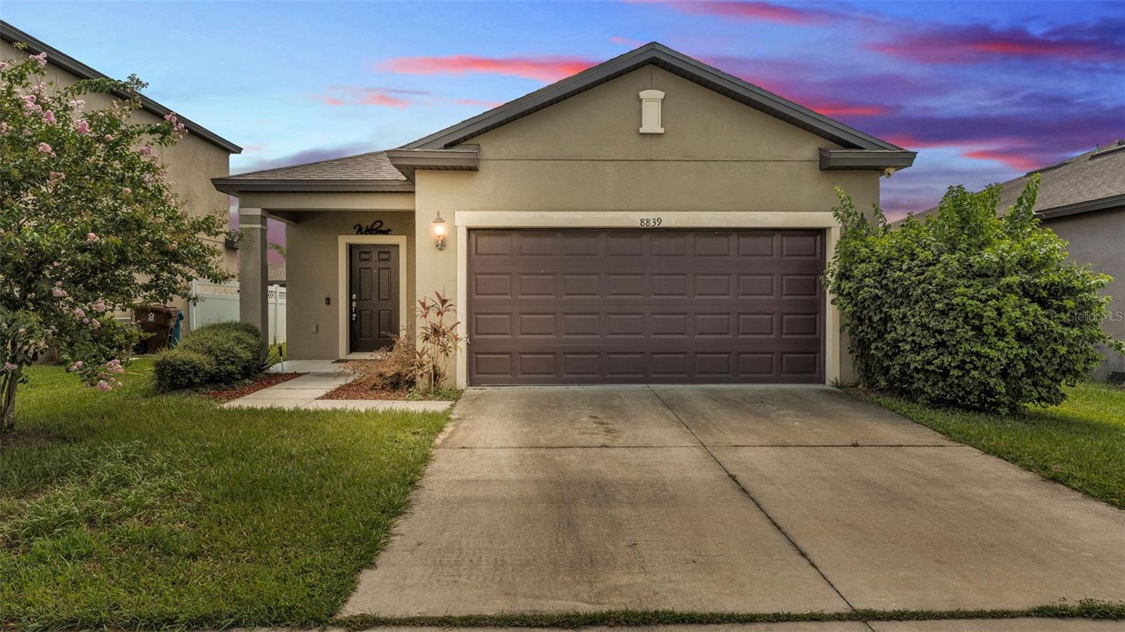 USDA Eligible! Welcome home - not only is his home eligible for USDA financing, it is also conveniently located minutes from I4 and the Polk Parkway. This beautifully maintained newer construction 3-bedroom, 2-bath home offers over 1,500 sq. ft. of living space and is perfect for a first-time buyer or growing family. Step inside to a lovely entry way that leads to a spacious family room with an additional private flex space—ideal for a home office or playroom. The desirable split floor plan features two bedrooms and a full bath off the main living area, while the private master suite is conveniently located near the kitchen and laundry area. The kitchen boasts a large island, ample cabinetry, and opens to a cozy dining area—perfect for hosting family meals. Enjoy outdoor living with a large concrete double patio for spacious entertaining. The backyard is nearly enclosed with vinyl fencing, just enclose sides to home for full privacy. Additional features include a double-car garage, in-ground sprinkler system, home security system, and an in-home water softener system. Don’t miss this incredible opportunity—schedule your showing today!