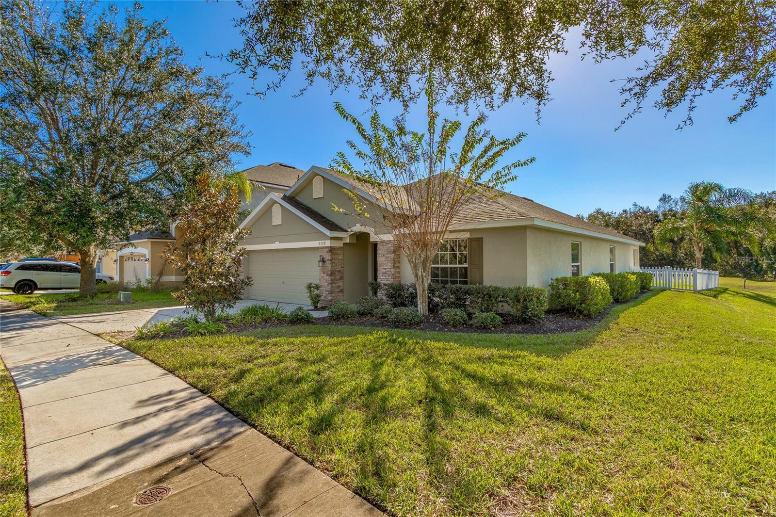 Comfortably located on Sebastian Street, this 1939 square foot home is more than 'move in ready'! This home has natural exterior colors and front brick, inviting front entrance with ring doorbell installed and a built in security system. The kitchen is spacious, overlooking the living room with views to the backyard. The back patio has beautiful brick flooring and your own fire pit for outdoor entertaining. Don't forget the front entrance will bring you to more living space for gatherings and lounging.
The colorful walls and window dressings bring light to this one story home. Bedrooms are located towards the back of the house with a center room which includes a full bathroom, closet and french doors. This additional fourth room separating the master and bedrooms is perfect office space! Ceiling fans throughout and high ceilings create a larger space for comfort. Abundant storage, laundry room with storage shelf, 2-car garage, large covered patio with fenced yard overlook the pond behind.
Quick walk to a beautiful clubhouse, up to date fitness equipment, swimming pool, basketball court and fenced dog-park. Short distance to downtown Mount Dora and to the 429 Expressway.