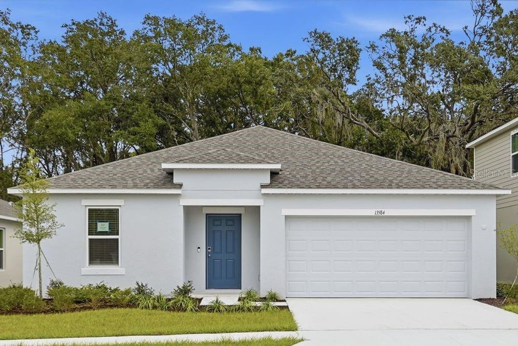 Photo of 13584 Tropical Breeze Way, Hudson, FL 34669 (MLS # TB8396160)