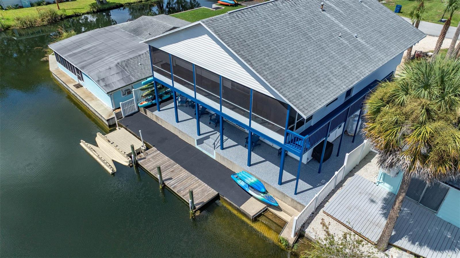 Welcome to your own piece of paradise on the Weeki Wachee River! This TURNKEY 2 bed, 2 bath home (with 1st story flex area that can easily be used as a 3rd bedroom) offers easy access to the main river for endless paddling and swimming with manatees in the crystal blue water! With no short-term rental restrictions, this income-producing property is perfect for vacation rentals or your own personal retreat. The home features 1,491 SF of 2nd story living space, and an additional 666 SF 1st level flex area.
The second level has 2 bedrooms and 2 bathrooms with an open floor plan that features a kitchen, dining, and living room combination with vaulted ceilings and plantation shutters. The oversized master bedroom has a walk-in closet, king-sized bed, desk, chair, and a large ensuite bathroom with jetted tub, walk-in shower, and plantation shutters. The guest bathroom has been recently remodeled with a shower and vanity. In addition to the king bed in the guest bedroom there is also a trundle bed in the living room. The 1491 SF 1st level has a 666 SF finished area and a separate 2 car garage are with spray foam insulation. There is plenty of parking in the driveway as well!
The outdoor space on this property is one of a kind. There is a 2nd story screened in porch, covered 1st story patio, stationary dock, floating dock with kayak launch, and seawall with stairs to the river. The home is being sold turnkey with everything in the pictures, from additional linens, to games, kayaks, and a fully furnished kitchen. Additional upgrades to the home include recent outdoor apoxy floors, new exterior paint, roof (2018), and new vinyl flooring. Property has transferable flood insurance!!
Weeki Wachee is famous for its crystal-clear spring-fed river, teeming with wildlife and offering a variety of water activities such as kayaking, paddleboarding, and fishing. Additionally, the area is home to the Weeki Wachee Springs State Park, where visitors can enjoy live mermaid shows and explore the underwater world in the park's submerged observatory. With its serene surroundings and close proximity to amenities, Weeki Wachee is the perfect place to call home or invest in a vacation rental property. Don't miss out on this opportunity to own a piece of waterfront heaven. Schedule your showing today!
