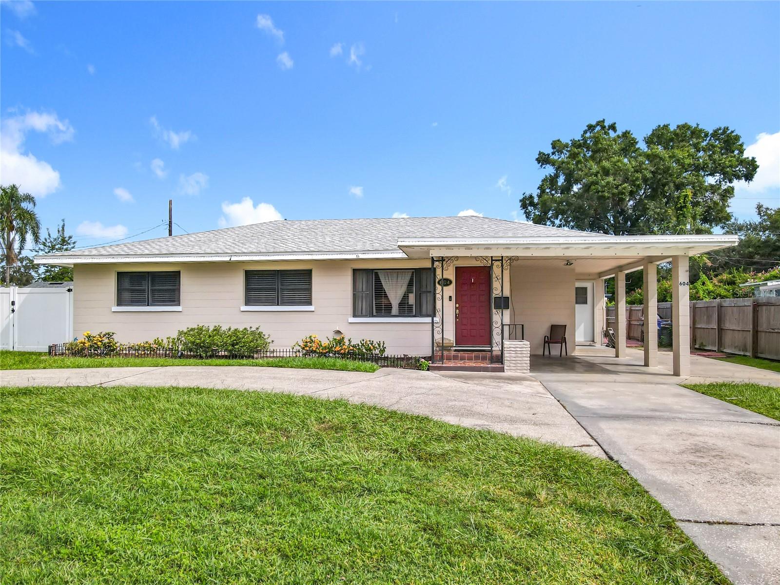 This charming property at 604 E Edgewood Dr offers exceptional versatility with four bedrooms and two bathrooms, the fourth room is perfect for a home office or creative space. The impressive oak ceiling that adds natural warmth and character throughout dining area. The standout feature of this property is the completely independent mother-in-law suite, offering a full bathroom, pantry, and dedicated refrigerator. This separate living quarters provides excellent flexibility for extended family arrangements or rental income opportunities, with total privacy and convenience for occupants. Two convenient storage sheds at the back of the property provide ample space for tools, seasonal items, or hobbies. Practical elegance shines through with the circular driveway offering easy access and impressive curb appeal. It has a new roof and fence in. Daily conveniences include Publix and numerous additional shopping and dining options nearby. The central location between Tampa and Orlando provides excellent commuting options and weekend accessibility to major areas. This property combines comfortable living spaces with income potential in a prime residential location.