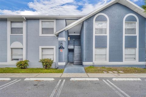 Photo of 4124 Pershing Pointe Place #4, Orlando, FL 32822 (MLS # O6387987)