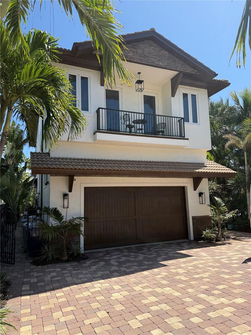 Paradise found! This stunning, sturdy and stylish home has undergone extensive renovation, but the position of this home on the Grand Canal is the true show stopper. Just one bridge separates you from the crystal blue waters of Roberts Bay. A corner lot with boating waters to the east and south means panoramic views of the deep water canal. The pool, spa and gorgeous paver deck will be your favorite spot to relax and watch boat traffic. For boat enthusiasts, your dock with a lift for a boat and a jet ski are ready for you. Two floors of luxury living with an extensive non-conforming space on the lower level, this home is perfection for the full or part time island dweller with dreams of enjoying life to the fullest on sunny Siesta Key!