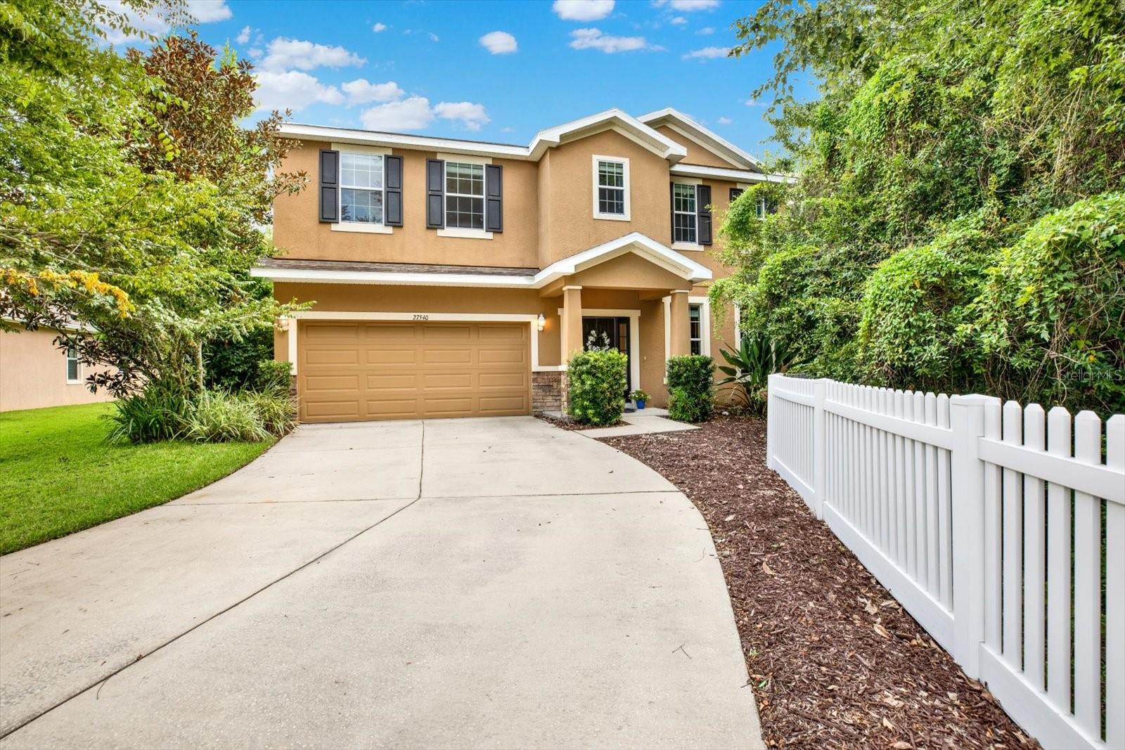 Location, convenience, and lifestyle can be found at 27540 Stonecreek Way. Perfectly situated in the heart of Wesley Chapel, this home sits on a premium cul-de-sac lot in the highly coveted Seven Oaks community. Seven Oaks community is established with mature landscaping that gives you a different feel than most communities in Wesley Chapel.
As you enter the gated community you will notice the privacy and tranquility that come with a cul-de-sac setting combined with a spacious lot that has endless potential. The home sits on a .25 of an acre that backs up to conservation behind and to the side of the home.
The 2700 sq ft home features 4 bedrooms, 2.5 bathrooms, an office and an extra flex space upstairs. The foyer welcomes you into the home with natural light and a beautiful view of the backyard through the sliding glass doors. The spacious living room and kitchen combination floorplan opens up the home with an island in the kitchen, tons of cabinets, granite countertops and stainless steel appliances
The primary suite offers a peaceful retreat with a large sitting space, walk- in closets, a primary bathroom with a stand up shower and spa tub. The loft/extra flex space is perfect for a game room or extra hang-out space upstairs with the other 3 bedrooms and full bathroom.
Seven Oaks residents have access to world-class amenities including three resort style pools, tennis/pickleball courts, basketball courts, sand volleyball, fitness center, clubhouse, nature trails and playgrounds. All just minutes away from top-rated schools, restaurants, I-75, and all the shopping you need to run your household.