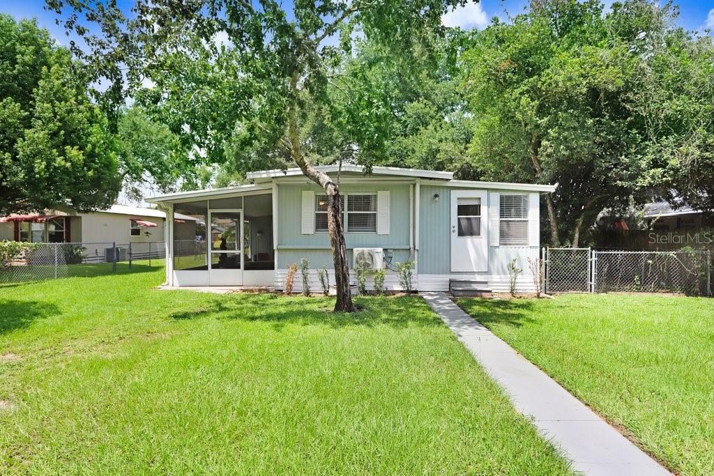 Own the land—NO HOA, NO CDD, and no lot rent. Tucked on a quiet dead-end street in Zephyrhills, this renovated 4-bedroom, 2-bath single-wide sits on a fully fenced 0.28-acre lot. Built in 1972, this single-wide features a spacious and delivers an efficient layout with an open kitchen/living room combo. The primary suite offers a large walk-in closet and private bath. Three additional bedrooms share the second full bath. Enjoy Florida living on the covered, huge screened side lanai plus a covered back porch. Convenient to shopping, medical facilities, hospital, SR-54, and US-301—yet peaceful at home. A versatile option for a primary residence or portfolio addition. All measurements and ages are approximate; buyer to verify.