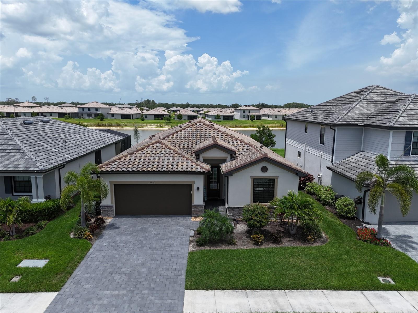 Be at the center Timber Creek in this move-in ready LAKE VIEW home, WALKING DISTANCE to the club house!!! Lennars' top model, the Trevi, offers a split floorplan with 3 bed, 3 baths plus a den/office, screened lanai & 2 car garage! Each bedroom is perfectly situated in each corner of the home primed for guest and owner privacy and luxury. Spacious kitchen with walk in pantry is open to both family & dining rooms and great for entertaining. Upgrades include double primary walk in closets, 3 linen closets, plush landscaping, seamless gutters, storm smart shutters, epoxy garage floor, double vanity primary, den option w/French doors & oversized tile. You will never tire of the spacious screened in lanai overlooking the beautiful Timber Creek Lake. Living The Timber Creek lifestyle is like being on full time vacation mode! Not only will you enjoy maintenance free living, but you’ll have access to SWFL’s hottest new resort style amenities including 2 pools, 2 restaurants, basketball, volleyball, pickleball, tennis, a fitness center, playground, bocce, arcade, coffee lounge, saunas, & so much more! Convenient access to Gateway, I-75, RSW & Fort Myers shopping, dining & Jet Blue Stadium. Spare the hassle of building & the high builder fees and get living NOW!! Schedule your private showing today! COME SEE THE DIFFERENCE - NO WAITING, NO HASSLES, NO HIGH BUILDER FEES AND THE PREMIUM LOCATION! SEE TODAY, Furnishings optional