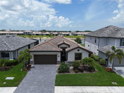 Photo of 13880 Pine Lodge Lane, Fort Myers, FL 33913 (MLS # TB8396358)