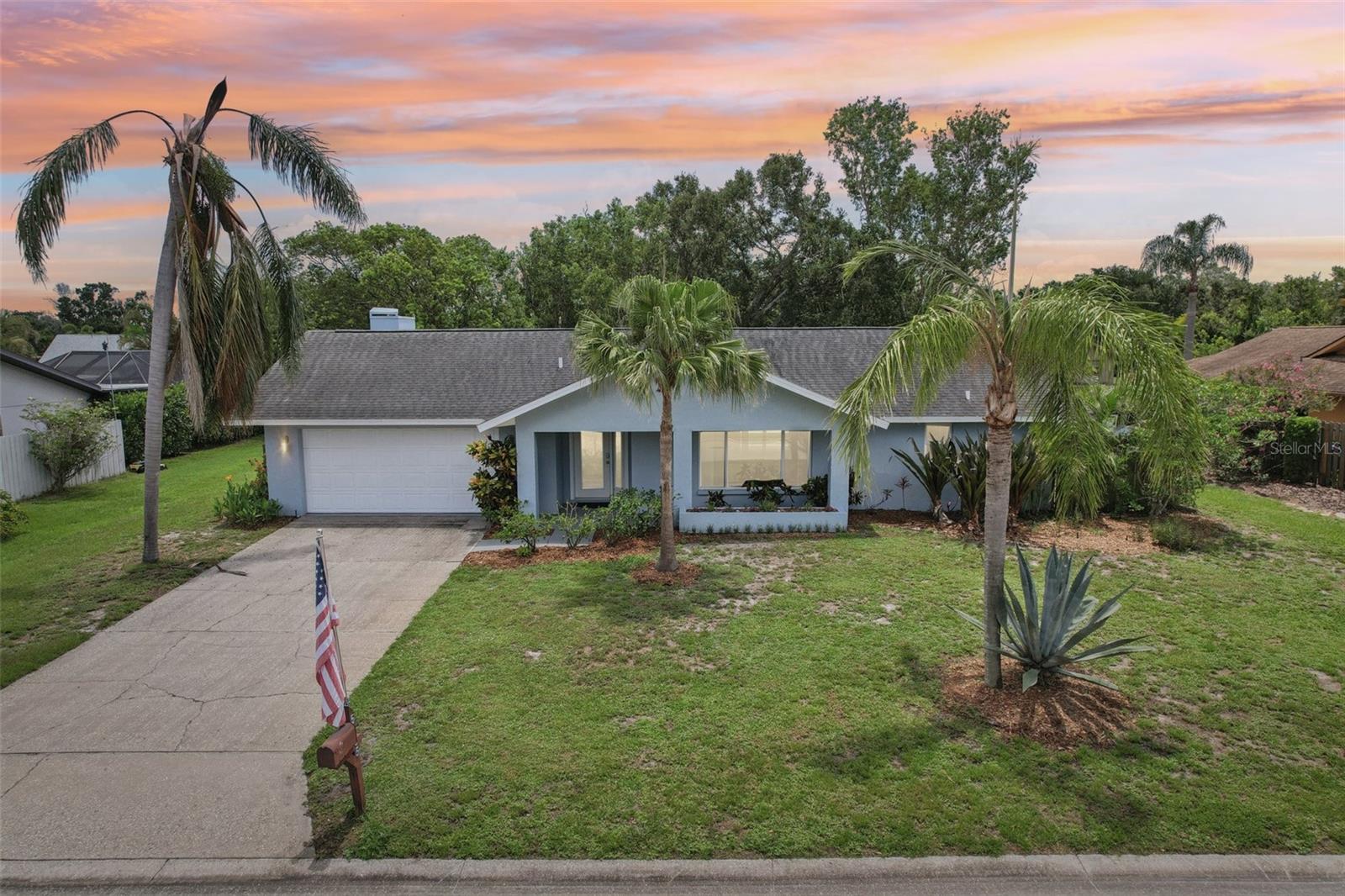 Welcome to 5385 Dominica Circle….a bright, happy, completely updated, waterfront, pool home nestled in a charming desirable canopied neighborhood in the heart of Sarasota. This meticulously maintained home has been beautifully modernized both inside and out. For starters and peace of mind, the home is equipped with hurricane impact windows and sits in an X flood zone. The well-lit interior features an open concept, split floor plan with 3 spacious bedrooms and 2 fully renovated spa-like bathrooms. The heart of the home is grounded by a sleek, updated, modern kitchen boasting stone counters, stainless steel appliances and lots of extras the chef will love. All rooms flow from the kitchen seamlessly to create a cozy inviting atmosphere with multiple areas for friends and family to gather. Neutral tile has been installed throughout the entire home. With a water view from every room, nature fills the home. Outside is a freshly redesigned pool area with a tree lined backyard overlooking a lake. The pool area has been designed as a serene tropical oasis complete with Caribbean blue heated salt water pool, elegant stone decking and a panoramic clear view screen enclosure to give you full water views. The super cute backyard is the perfect spot to watch the wildlife under the shade trees from the bench swing or take a nap in the comfy hammock. Excellent location easy & convenient, short drive to beaches, mall, shopping, restaurants, fitness trails & entertainment. 100% move-in ready just bring your flip flops and a bikini! Call me today for personal tour.