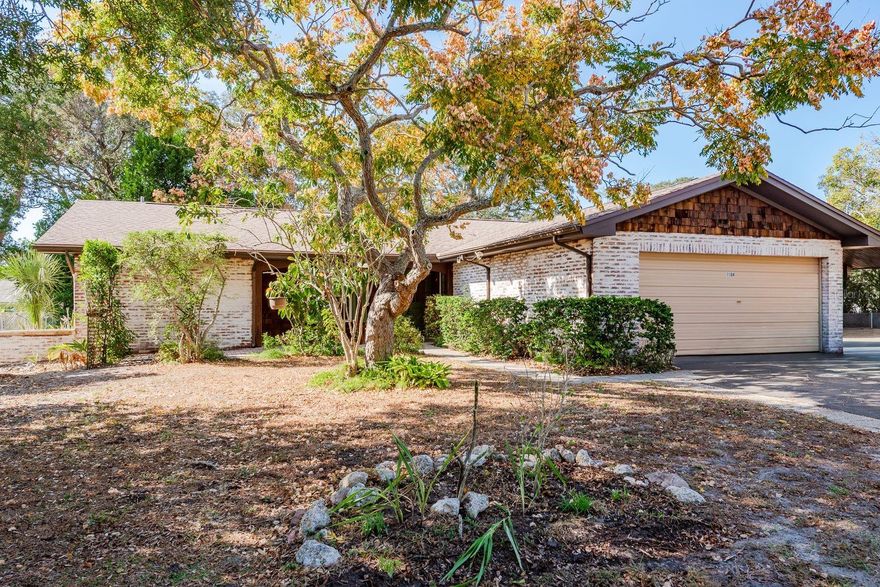 Welcome to this beautifully maintained 4-bedroom, 2-bathroom home, freshly painted inside and out. Situated on a spacious corner lot with excellent outdoor space, this property is free of HOA restrictions, giving you added flexibility and freedom.  Inside, you’ll find an updated kitchen with a cozy eat-in area, a formal dining room, and a walk-in pantry offering abundant storage. The home features hardwood floors and tile throughout, creating a warm and cohesive feel. The primary bedroom includes an ensuite bathroom, and three additional bedrooms share a well-appointed second bath. The large living room opens to a private patio through sliding glass doors—perfect for relaxing or entertaining. Additional highlights include an oversized 2-car garage with a washer and dryer. This home is ideally located near the Greektown Historic District, known for its charming shops, restaurants, and famous sponge docks. It is also conveniently close to Sunset Hills Elementary School and Tarpon Springs Middle and High Schools, all less than a mile away.  Enjoy a home that is within a short drive to several beaches and Fred Howard park!