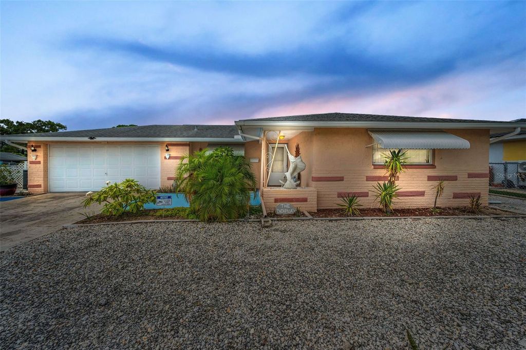 Photo of 7735 Canna Drive, Port Richey, FL 34668 (MLS # W7878054)