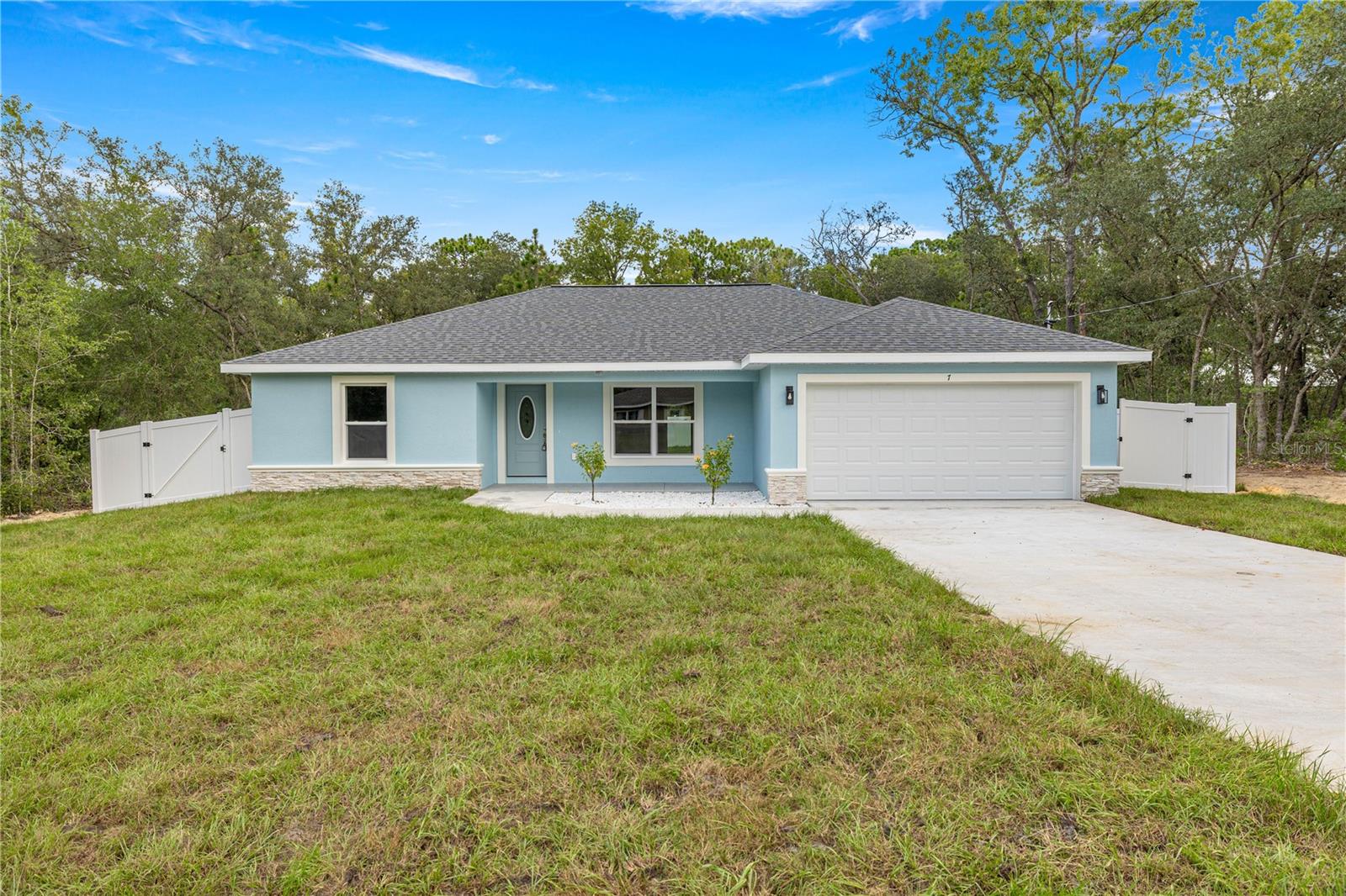 New Construction – Move-In Ready! Just Minutes from Lake Weir!
This beautifully crafted 3-bedroom, 2-bath split floor plan home offers modern design, quality finishes, and functional living space. The open-concept layout features luxury vinyl flooring throughout, ideal for both daily living and entertaining. The kitchen is a standout with stylish shaker cabinets, quartz countertops, stainless steel appliances, and contemporary lighting.
The spacious primary suite includes a large walk-in closet and a luxurious ensuite bathroom with elegant porcelain tile. Step outside to your private backyard oasis, complete with a patio for relaxing or hosting under the stars. A full privacy fence provides added comfort and seclusion.
Located less than a mile from Lake Weir, you're just minutes from popular waterfront dining spots like Gator Joe’s and Eaton’s Beach.
Don’t miss the opportunity to own this stunning new home that blends modern style, everyday comfort, and unbeatable convenience!
Photos shown are of the actual completed home.