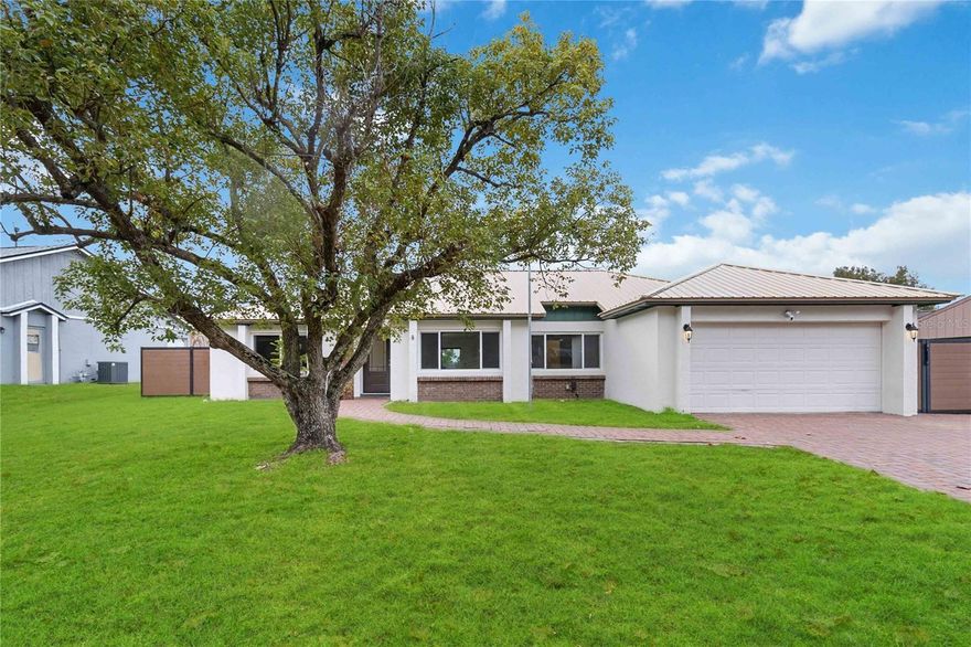 Beautifully updated three bedroom, two bathroom home that has it all!  Beginning outside the home has a new metal roof installed in 2017. 
 The newly installed paver driveway was widened for more space!  The fully fenced backyard has a double gate to store whatever you need behind the privacy fence on the side of the house. Step inside and be greeted by new luxury vinyl plank flooring throughout the home and freshly painted interior. Entering the home the living room is on your right with the dining room straight ahead.  In the entry way there is a built in bookcase with storage behind it.  The kitchen is the focal point of the home.  This kitchen is a dream!  Fall in love with the beautiful quartzite counters and backsplash.  The large island has plenty of room to gather around and enjoy conversations.  This kitchen was beautifully designed with function in mind.  There is a pull out spice rack next to the gas range, a pull down knife block, pull out waste basket, soft close cabinets and drawers, great stainless steel appliances and so much more.  Off of the kitchen is the office, which could be used as a fourth bedroom.  The primary suite has his and hers walk in closets and a completely updated serene bathroom with a gorgeous walk in shower!  The large mudroom has extra storage, the washer and dryer hook ups, access to the garage and a dog door leading out to the dog run!  The home features a split bedroom plan for added privacy.  The secondary bedrooms share the additional full bathroom.  Outside there is a pavered patio area where you can you enjoy the large fenced backyard overlooking what was Deer Run golf course and will soon be a new city park.  New double paned windows! New exterior paint! In line gas water heater! Come see this beautiful home today!