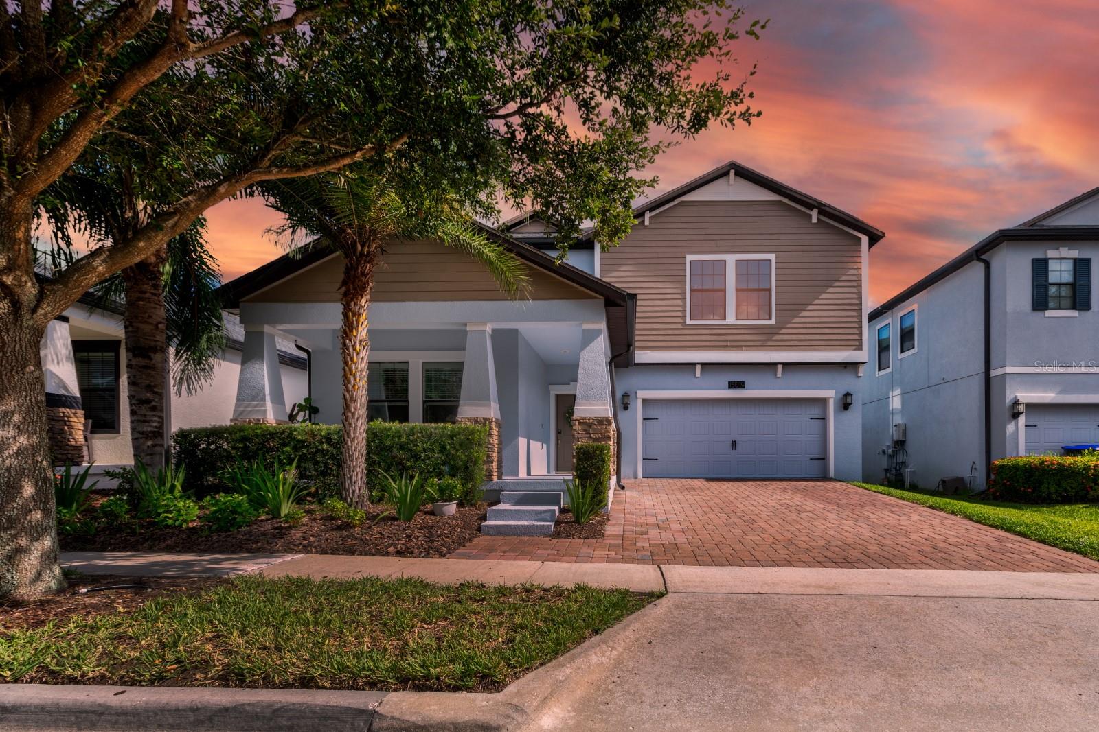 Welcome home! This bright and beautifully maintained five-bedroom, three-bathroom home with an office nook is located in the highly sought-after community of Summerlake in Winter Garden. Offering over 3,200 square feet of living space, a spacious fully fenced backyard, and a three-car tandem garage, this home features fresh exterior paint in 2024, brand new carpeting upstairs, and luxury vinyl plank flooring on the stairs and in the downstairs guest suite. The kitchen boasts wood cabinets, granite countertops, a newer gas stove, newer refrigerator, center island, breakfast bar, and an eat-in nook, all flowing seamlessly into the living and dining spaces. Sliding doors with plantation shutters open to a screened porch and extended paver patio overlooking the backyard. The upstairs primary suite offers his and hers walk-in closets, dual sinks, a soaking tub, and a walk-in shower. All upstairs bedrooms include walk-in closets, and an expansive loft is perfect for a game room or second living area. Community amenities include a resort style pool, clubhouse, fitness center, fishing dock, zipline, playgrounds, tennis and basketball courts, dog park, and nightly Disney fireworks views. Conveniently located just minutes from Hamlin Town Center, Winter Garden Village, Historic Downtown Winter Garden, and FL 429, with easy access to Orlando’s top attractions including Disney, Universal Studios, and SeaWorld.