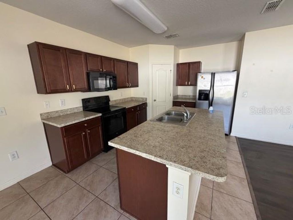 Photo of 117 Tanager Street, Haines City, FL 33844 (MLS # S5150010)