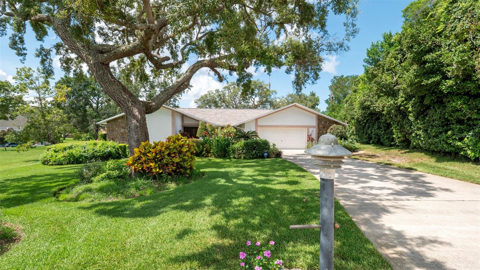Charming 4-Bedroom Home with Pool and Fireplace in Gated Community
Welcome to this inviting one-story home, tucked at the end of a quiet cul-de-sac in a secure gated community. Surrounded by mature landscaping and a lovingly cared-for front garden, this home offers peaceful living with plenty of space both inside and out.
The thoughtful floor plan features four bedrooms, with the primary suite privately located on the opposite side of the home—perfect for added comfort and separation. A spacious screened lanai, ideal for enjoying the outdoors year-round, is accessible from two bedrooms, a bathroom, the dining area, and the formal living room, creating a natural flow for indoor-outdoor living.
Inside, the family room is centered around a cozy fireplace, perfect for adding warmth and ambiance during cooler evenings or holiday gatherings.
Step outside to enjoy the large enclosed pool area and expansive backyard—plenty of room for family gatherings, gardening, or simply relaxing in the Florida sunshine.
This home features a brand-new roof installed in May 2025, offering peace of mind and added value. Additionally, there is no known history of hurricanes significantly impacting this area, providing an extra layer of confidence in the property's long-term security.
Inside, the home is full of potential, offering classic charm and a solid layout ready for your personal touch. Whether you're looking to update with modern finishes or embrace its vintage style, there’s endless opportunity to make it your own.
Ideal for a growing family or anyone seeking a peaceful retreat with space to spread out, this home combines location, comfort, and promise.