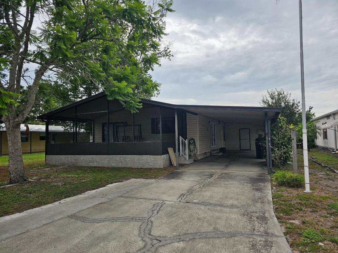 PRICE REDUCED, VERY MOTIVATED SELLER OPEN TO OFFERS. THIS IS A 55+ COMMUNITY. YOU OWN THE LAND THAT THIS 2 BEDROOM, 2 FULL BATH, MANUFACTURED HOME SITS ON, SO THERE'S NO MONTHLY LAND LEASE FEE, JUST A LOW QUARTERLY HOA FEE OF $192. THE PROPERTY IS NOT IN A FLOOD ZONE, SO NO FLOOD INSURANCE IS REQUIRED. THE BACK YARD LOOKS OUT ON A LARGE GREEN, PARK-LIKE AREA, SO NO BACKYARD NEIGHBOURS. IN THE FRONT, YOU'LL FIND A LARGE SCREENED-IN PORCH, FROM THE PORCH, STEP INSIDE INTO THE OVERSIZED LIVING ROOM. THE EAT IN KITCHEN HAS PLENTY OF ROOM FOR A DINING TABLE. DOWN THE HALL YOU'LL FIND 2 GOOD SIZED BEDROOMS AND 2 FULL BATHROOMS. THE OVERSIZED CARPORT CAN EASILY HANDLE 2 VEHICLES PARKED TANDEM. A SMALL LAUNDRY/STORAGE SHED IS LOCATED AT THE END OF THE CARPORT. THE COMPLEX ALSO HAS A CLUBHOUSE AND LARGE SCREENED IN COMMUNIY POOL. THIS HOME IS VACANT AND EASY TO SHOW. ALL INFORMATION IS DEEMED TO BE ACCURATE, BUT NOT GUARANTEED, BUYER, OR BUYER'S AGENT TO VERIFY ALL PERTINENT INFORMATION.