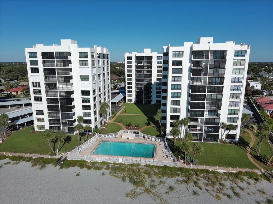 Move in and do nothing.  This 10th floor residence in Valencia Condo Apts. in Venice FL has lots of updates, including luxury vinyl plank flooring throughout, new kitchen cabinets, range and refrigerator, bar with built in cabinetry, crown moldings, and unique quartz waterfall countertops.  Both baths have been tastefully updated.  Enjoy multiple views- take in the Venice city lights or watch the gulf from your screened balcony.  The building has a new roof and the security of new hurricane rated windows.