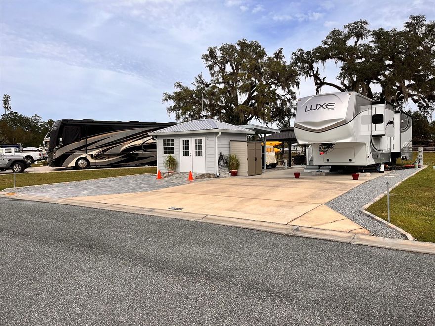 What an amazing opportunity. Should one decide that they need an RV lot with an RV. Then this is for you. The RV is a 2022 Luxe 39FB it can be purchased at $140K well below what it was purchased at. Should you want more information you can Google Luxe 39FB and there is a video that shows exactly how it was built. The lot is certainly above any expectations you could have. With no back neighbors and all the fantastic amenities it features makes it one of a kind. The lot features pavers, rock and gazebo. The shed has water and power with stub outs for sewer. Come and enjoy Wilderness RV Resort. 55+ magnificent river front community. Come enjoy all Ocala has to offer. 55+ Oasis awaits you. This is a 55+, however if you are not 55yrs old you can still buy in here. You just can't live in it permanently. But you can rent it out when you are not enjoying it for yourself. Can be used for short and /or long term rental. It feels like you are out in the middle of wilderness with the river and the forest. But jump on Hwy 40 and go just 7 miles and everything you want is there. Enjoy the day kayaking from Silver Springs Park take the river down stream you can pull your kayak out here at the resort. There are Jeep trails minutes away. Fine dining and all that historic downtown Ocala has to offer is just minutes away. Kid Friendly 2 weeks at a time are allowed. There is so much to do Kayaking, walking trails, community Pool and many more amenities are offered within the community, Located near multiple state parks such as Silver Springs, Juniper Springs, Salt Springs, Museums, Nature trails. Come and enjoy nature at it's finest.