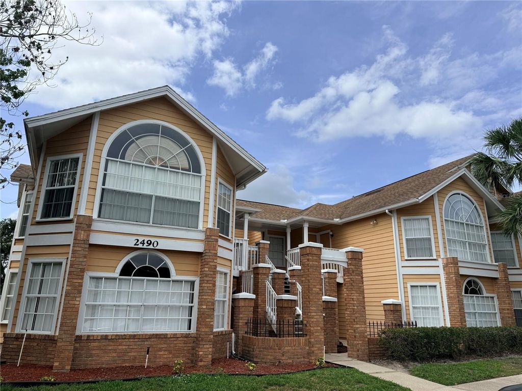 Photo of 2490 Sweetwater Club Circle #67, Kissimmee, FL 34746 (MLS # S5151259)