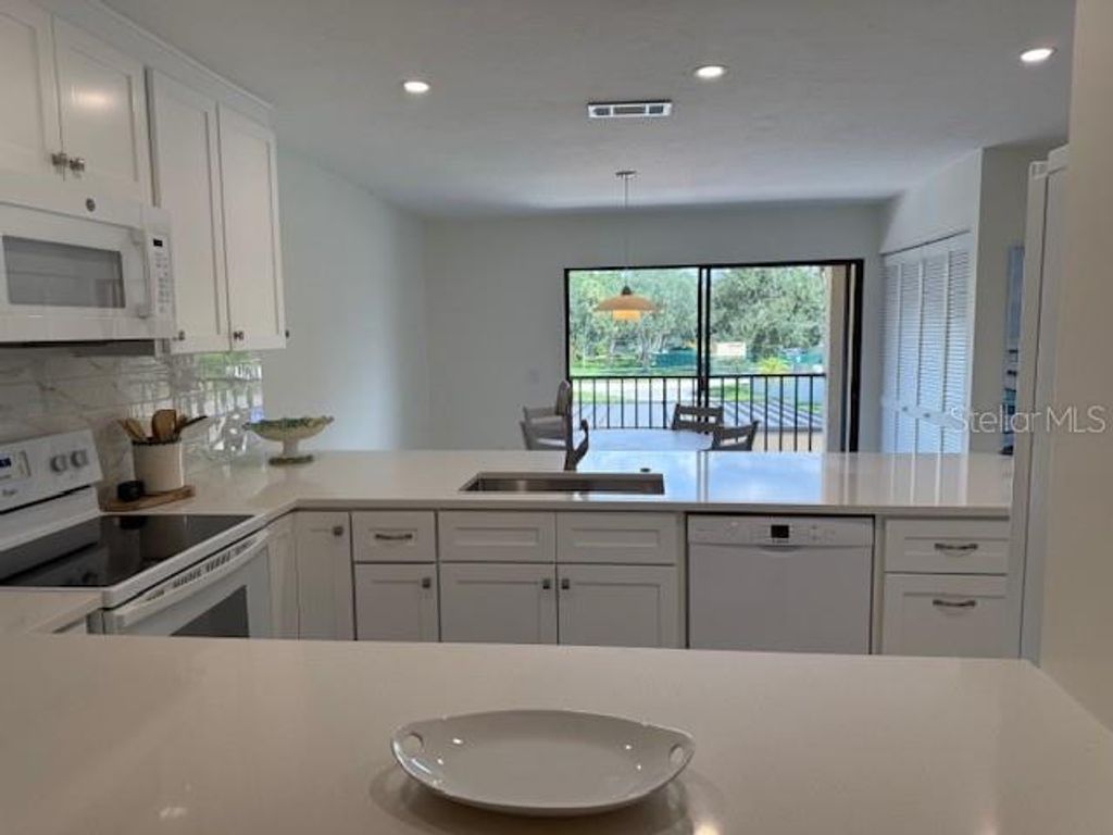 Photo of 6120 Country Club Way #207, Sarasota, FL 34243 (MLS # A4663598)