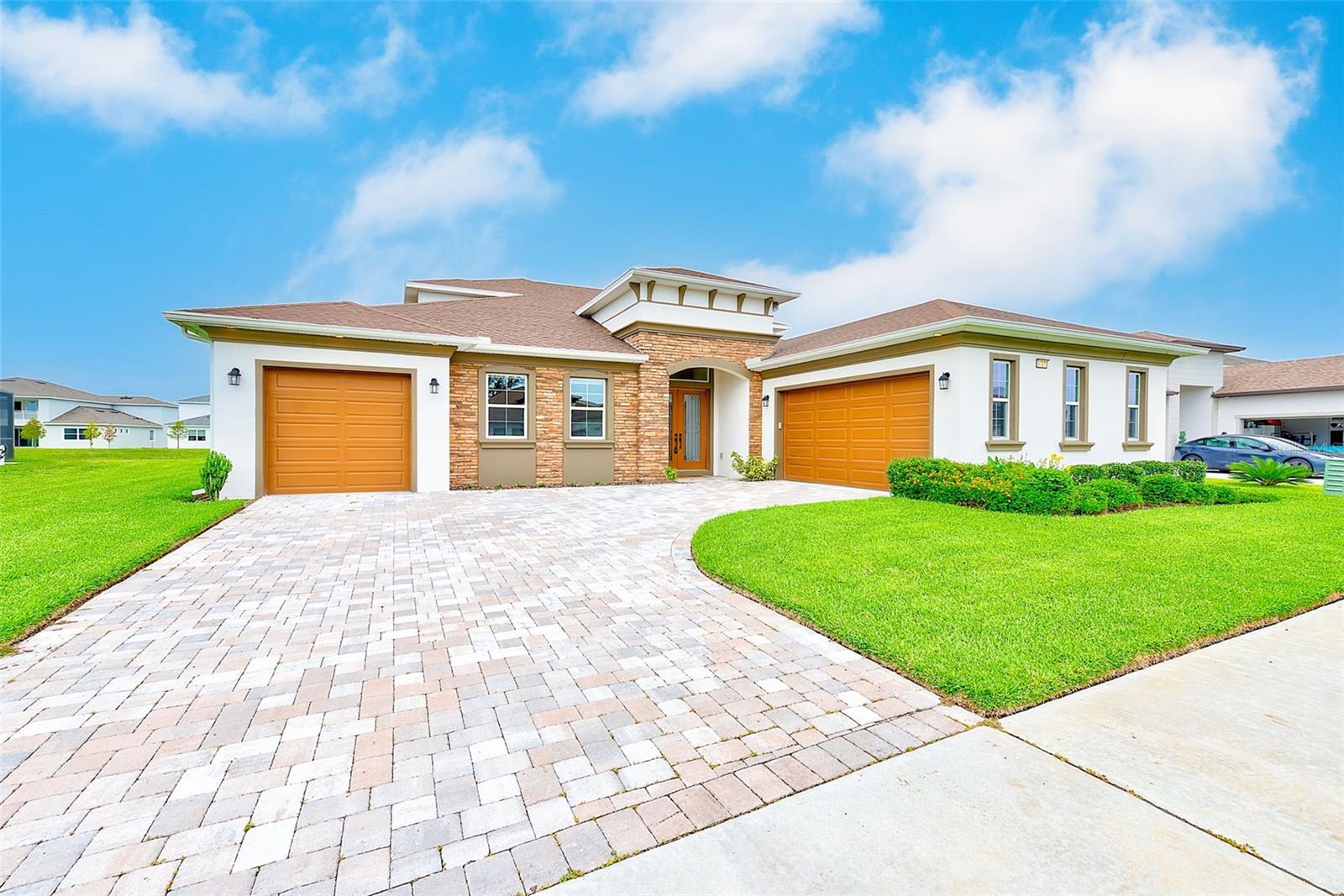 Welcome to an exquisite six-bedroom, four-and-a-half-bathroom residence with a three-car garage, offering an impressive 4,635 sq. ft. of luxurious living space. Created by the esteemed Biscayne Homes, this contemporary gem is perfectly nestled in the desirable King Lake Estates within the exclusive Epperson Lagoon Community.
Enter the chef’s kitchen, a culinary paradise, featuring a grand center island, top-of-the-line stainless-steel appliances, a sleek wall oven, a smooth cooktop, and an elegant stainless hood, all seamlessly integrated with custom built-in cabinetry. Enjoy breathtaking views of peaceful waters and lush conservation areas from your expansive windows. The spacious master suite on the main floor is your private retreat, complemented by a spa-like master bath that offers the ultimate relaxation experience. Upstairs, discover a vast bonus room, ideal for movie nights and unforgettable gatherings.
Enhancing your outdoor experience, this home is equipped with a mosquito and no-see-um misting system, safe for pets and children. With its automatic timer and phone app control functionality, you can enjoy the fine mist emitted through stainless steel nozzles discreetly placed around the exterior, transforming your outdoor living into a bug-free sanctuary.
As a resident of this remarkable community, indulge in high-speed internet, premium cable, and exclusive access to the stunning Crystal Lagoon—an expansive 7-acre paradise featuring a swim-up bar, kayaking, paddleboarding, sandy beach access, cabanas, volleyball courts, and an exciting calendar of community events. Ideally situated near shopping and dining, this home is just 35 minutes from Tampa International Airport, providing a lifestyle that perfectly balances luxury and convenience.
Just a short walk away, immerse yourself in the 7.5-acre lagoon, where you can soak up the sun on sandy beaches, enjoy exhilarating water sports, and participate in year-round activities like yoga retreats and movie nights under the stars. Stay effortlessly connected with UltraFi high-speed internet, perfect for both work and leisure. Community highlights include scenic trails and expansive green spaces in Eagle Park, along with the Lake House featuring state-of-the-art fitness facilities and picturesque views. Explore the charming butterfly garden, playground, dog park, and extensive trails, perfect for biking, jogging, or serene golf cart cruising. Experience a new standard of modern living—this is more than just a home; it’s a vibrant lifestyle.