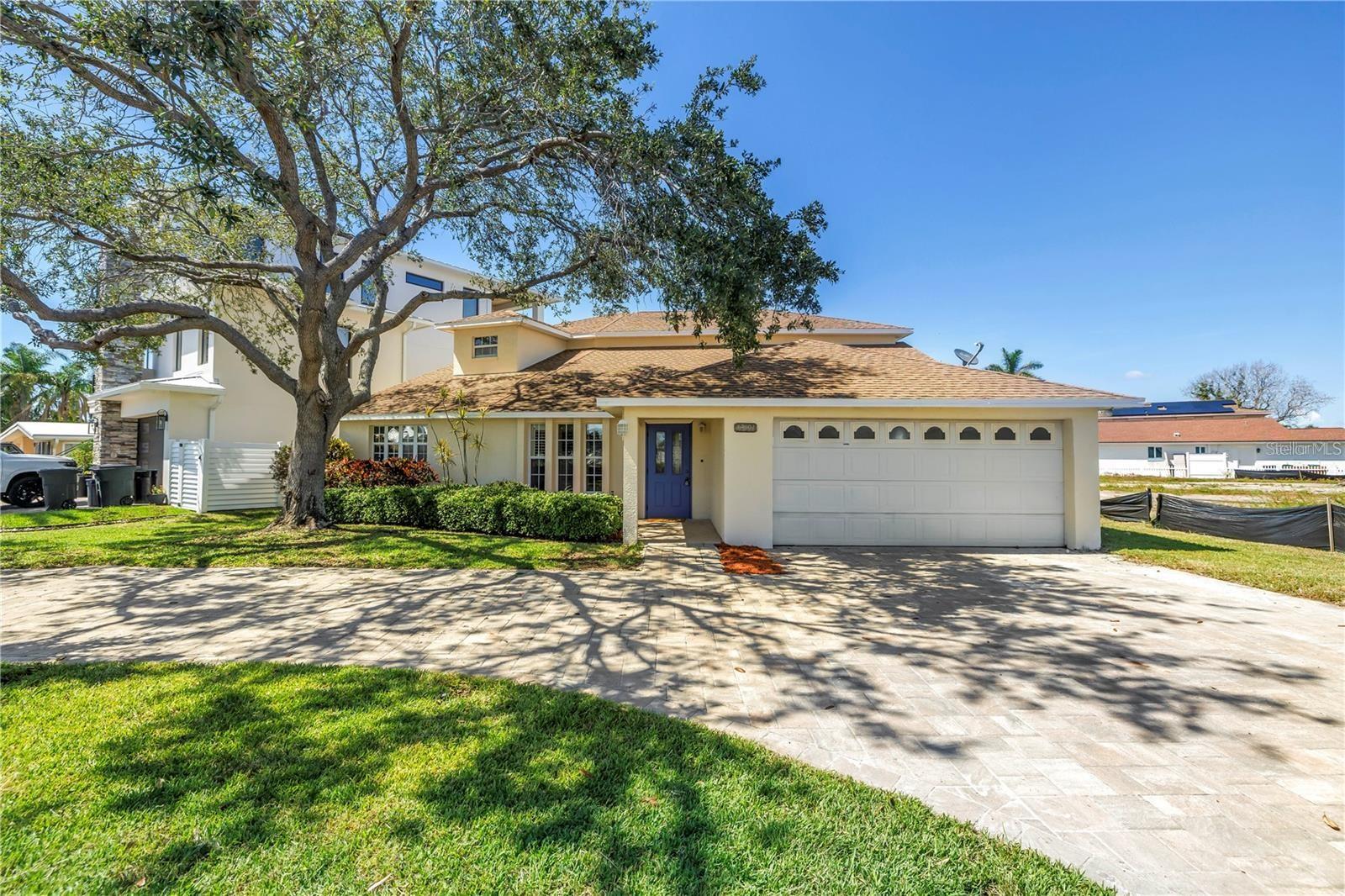 Welcome to your elegant coastal retreat — a beautifully updated 4-bedroom, 4-bathroom home on a coveted corner lot, just a short stroll or bike ride from the lovely shores of Redington Beach.
From the moment you arrive, the appealing circular driveway and manicured landscaping set the tone for this luxury home. Inside, you’ll find high-quality materials and posh finishes throughout, including brand-new marble countertops, top-of-the-line appliances, and thoughtfully appointed spaces that truly make this residence shine.
The main floor offers two bedrooms and two bathrooms — one of which is an en-suite — each with elegant finishes, while the second level is the pinnacle of comfort with two additional en-suite bedrooms and two bathrooms, including an expansive owners’ suite that’s the ultimate retreat. Enjoy spanning water views, double vanities, a luxurious rain head shower, and a soaking tub with serene water views. Two spacious walk-in closets add to the suite’s superb appeal.
The main floor offers two bedrooms and two bathrooms, each with elegant finishes, while the second level is the pinnacle of comfort with two additional en-suite bedrooms and two bathrooms — including an expansive owners’ suite that’s the ultimate retreat. Enjoy spanning water views, double vanities, a luxurious rain head shower, and a soaking tub with serene water views. Two spacious walk-in closets add to the suite’s superb appeal.
Step outside through your private door to a large balcony, also accessible from the second upstairs bedroom, and take in the gorgeous views — perfect for morning coffee or sunset unwinding.
For those who love boating, this property also features a dock, offering the ideal spot to launch into the open water and enjoy waterfront living to the fullest.
The home is beautifully appointed for outdoor entertaining too — with a covered grill area, upper deck and that unbeatable proximity to the beach.
Every detail reflects the pinnacle of coastal luxury, ready to welcome you home to your own slice of paradise.