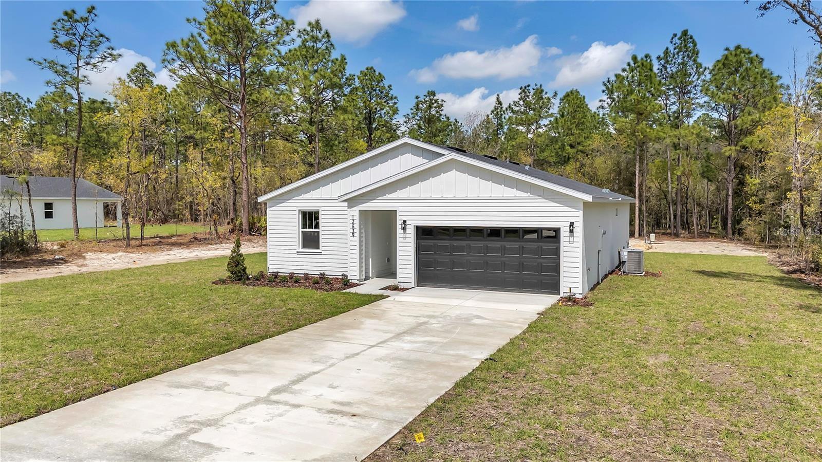 Brand new home in Rolling Hills! Come stretch your legs on an acre lot in this three bedroom, two bath home. Split floor plan, shaker cabinets, quartz counters, inside laundry, ceramic tile throughout, attached garage. No HOA! Rolling Hills is located just a short drive from the World Equestrian Center to the east and Rainbow Springs to the west in southwest Ocala!