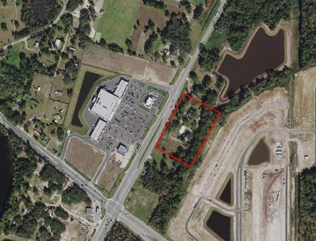POTENTIAL COMMERCIAL DEVELOPMENT SITE - This is a unique opportunity to own 4+/- acres with 600' highway frontage on US Hwy. 17/92, located directly across from a Publix-anchored retail center. The land is designated by Polk County with a Community Activity Center (CACX) Future Land Use which is ideal for retail commercial, mixed-use, or high density residential. Buyer is responsible to conduct due diligence inspections, including zoning and land use regulations, market analysis, and feasibility studies, to determine the full potential and viability of this investment opportunity. The property currently contains multiple residential buildings and is caretaker/tenant occupied.