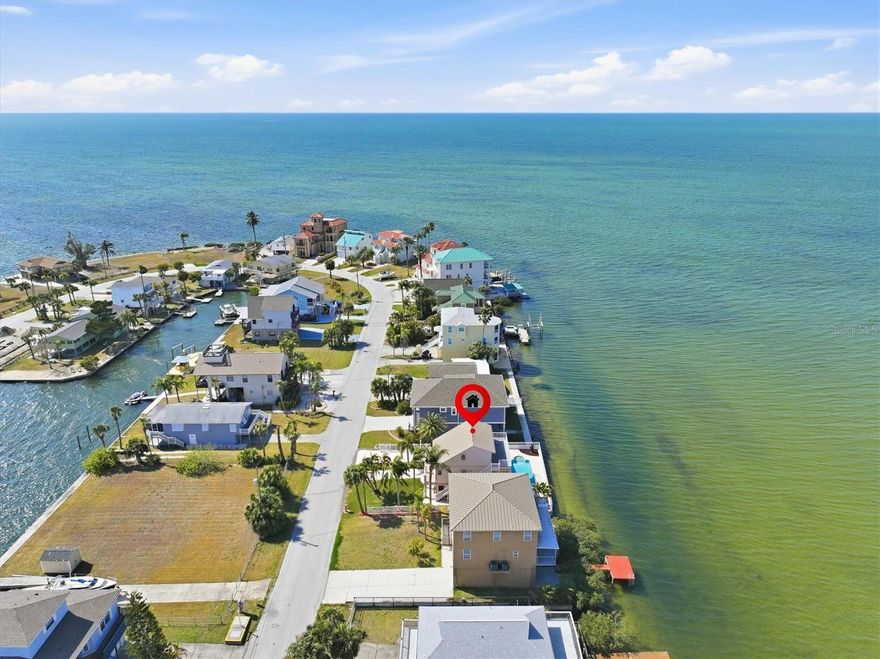 Have you dreamed of a pool home with the Gulf as your backyard? This is your opportunity to live the ultimate Gulf Coast lifestyle with 60 feet of concrete seawall directly on the open Gulf.

This exceptional 3-bedroom, 3-bathroom pool home sits on a peninsula, offering panoramic Gulf views from nearly every window. Wake up to endless blue water, unwind with golden sunsets, and enjoy the rare experience of true open-water living. Imagine relaxing in your heated pool and spa as dolphins, manatees, and even sea turtles glide past your backyard.

Designed to blend coastal elegance with comfort, the home features vaulted ceilings in the living room, crown molding, travertine and porcelain tile flooring throughout, and solid wood kitchen and bathroom cabinetry topped with granite countertops. Double thermopane windows with tinted security film fill the home with natural light while enhancing efficiency and privacy. Stained and etched glass doors, a stunning Waterford chandelier, outdoor lighting, and an electric privacy screen on the porch add distinctive character and charm. The interior and exterior have been freshly painted, and major updates include a new roof and AC in 2017.

The third-story primary suite is a true retreat, featuring a soaking tub positioned by a Gulf-view window and private access to an outdoor porch with breathtaking open-water views. A permitted ground-level in-law suite offers its own bedroom, bathroom, living room, laundry, and private entrance—perfect for guests or multigenerational living.

Step outside to your inground heated pool and spa with a concrete deck and fencing, all directly on the Gulf. An outdoor pool shower and toilet provide added convenience for entertaining and waterfront living.

For anglers and boaters, this is a Gulf Coast fishing dream. Catch redfish, snook, and snapper right from your seawall while watching marine life play in the waters behind your home. A channel behind the property provides boating access to the Gulf and is scheduled for future re-dredging by the county. While there is currently no dock or lift, both are permitted should a future owner wish to customize the property for their boating needs.

Located in the heart of Hudson Beach, this home places you in one of Florida’s most authentic waterfront communities. Just north of Tampa along the scenic Gulf Coast, Hudson Beach offers a laid-back boating culture reminiscent of Key West in the 1970s—quirky, welcoming, and deeply connected to the water.

Here, boating isn’t a hobby—it’s a way of life. Direct Gulf access, marinas, waterfront tiki bars, and locally loved seafood restaurants define the lifestyle. The small public beach becomes a gathering place for neighbors and visiting boaters alike. A thriving commercial seafood industry, especially shrimping and stone crabbing, keeps the working-waterfront heritage alive and woven into daily life.

With convenient access to US 19, shopping, dining, medical facilities, and everyday essentials are just minutes away. Tampa International Airport is approximately an hour away, and the attractions of Orlando are within 90 minutes.

This is more than a home—it’s a front-row seat to the Gulf Coast boating lifestyle, where days revolve around tides, fishing lines, and unforgettable sunsets over open water. Welcome home.