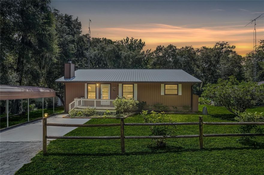 It may be fate that is sending this home your way, or some other agency, but in these days of uncertainty, here is one thing of which you can be certain: THIS is the home for you if peace and quiet is your desire and you’re searching for a beautifully-remodeled waterfront home with brand new metal roof, brand new HVAC, and no HOA—located high-and-dry above the Withlacoochee River with direct views of a 50-acre bird sanctuary. Offering over 1,800 sq ft, this 3 bedroom, 2 bathroom home features tile flooring throughout, a remodeled kitchen with granite countertops and new appliances, and two living rooms with a fireplace. The primary suite overlooks the river and includes dual closets, bonus flex space, and a remodeled bath with dual vanities and a tiled walk-in shower. For extra convenience, the laundry room (with new appliances, sink, plenty of shelves and a sturdy workbench) has two entrances. Downstairs, a 600 sq ft workshop, with exterior access, provides ample storage, two large workbenches, and an additional full-sized refrigerator/freezer and sink. There is also 230V power for EV charging or RV hookup. Enjoy coffee, meals, casual sitting or relaxing on the hammock within the screened-in back porch overlooking the river and bird sanctuary. Mature oaks share the large fenced back yard with flower beds. Small boats, canoes or kayaks can be launched directly into the river; for larger craft the community maintains a private concrete boat launch. Situated in the same county as The Villages but with none of the latter’s noise, traffic, and other hustle and bustle, this serene sanctuary is located just two minutes from the Withlacoochee State Forest and convenient to Tampa, Ocala and Orlando. And it’s ready for you and your family to move in now.