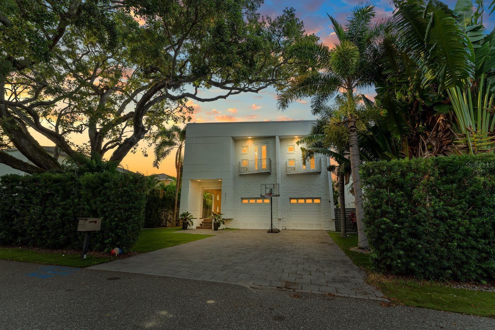 Huge Price Reduction from 2M to 1,825. The only 6-BEDROOM pool home for sale in South Tampa UNDER $2M — don’t miss out!! Located just minutes from iconic Bayshore Boulevard and vibrant downtown Tampa. 6-bedroom, 4.5-bath pool home offers 4,701 sq ft under air—far exceeding the average in this price range, where most homes are between 3,500 and 4,000 sq ft. Built on one of the HIGHEST ELEVATIONS in the area, this HOME WAS ONE OF THE FEW HOMES UNAFFECTED the most recent HURRICAN—offering rare peace of mind, SUPERIOR DRAINAGE, and long-term value in a prime location. Fully remodeled in 2018 and built with SOLID CONCRECT BLOCK construction from top to bottom, the home delivers unmatched structural integrity. The OPEN-CONCEPT floor plan features soaring ceilings, abundant natural light, and a seamless indoor-outdoor flow. A wall of glass in the family room and kitchen opens to a SALTWATER HEATED POOL and HOT TUB, surrounded by MAINTENANCE-FREE TURF LANDSCAPING. The chef’s kitchen includes a MARBLE island, SUB-ZERO refrigerator, WOLF gas cooktop, and Bosch dishwasher. Upstairs, the primary suite features a spa-style bathroom, custom walk-in closet, and PRIVATE BALCONY overlooking the backyard oasis. Access the second floor via floating stairs or a PRIVATE ELEVATOR Additional highlights: Home theater room. Whole-house water filtration system. Oversized 2-car garage (expandable to 4-car with lifts). SMART HOME TECH: Nest thermostat, surround sound, and security system. Located on a QUIET, family-friendly street. This is a rare opportunity to own a luxury home in one of South Tampa’s most sought-after neighborhoods.