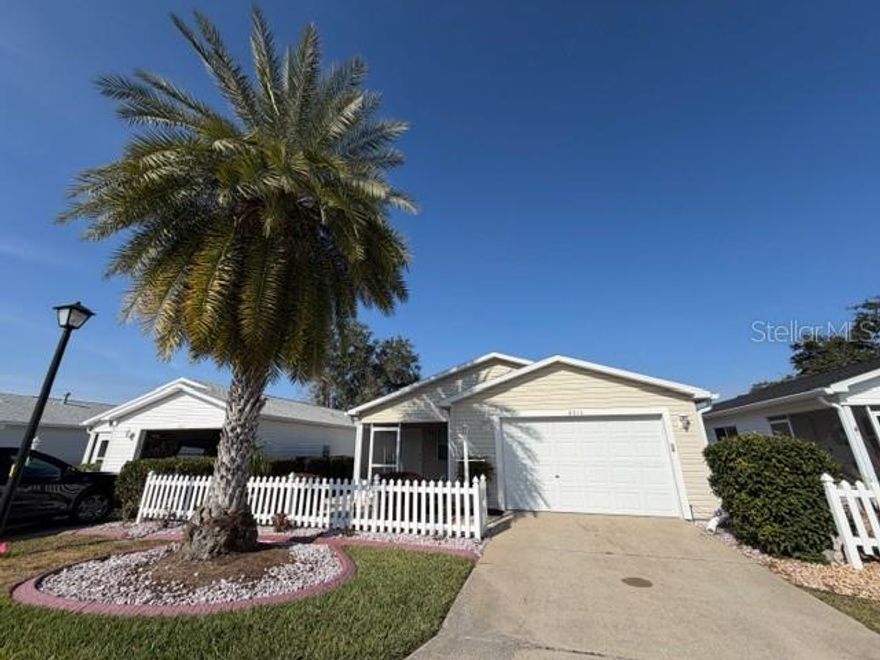 Welcome Home! Discover this stunning Colony Patio Villa rental located in the desirable Village of Santiago. Step inside to find vaulted ceilings and tasteful décor that create an inviting atmosphere throughout the home.

The kitchen features new stainless steel appliances, a cozy coffee table with four chairs, and an additional counter with two chairs, perfect for casual dining. Both the kitchen and bathrooms boast brand new quartz countertops for a modern touch. The dining area is equipped with a table and four chairs, complemented by an elegant china cabinet.

Relax in the spacious living room, furnished with two recliners, a center table, a TV, and two side tables with lamps, creating a perfect retreat for unwinding after a long day. The screened front patio is ideal for enjoying morning coffees or evening relaxation.

The primary suite offers a queen bed, stylish dresser, two night tables with lamps, and a large walk-in closet for ample storage. The en-suite bathroom features a walk-in shower for your convenience. The guest bedroom also has a queen bed, two night tables with lamps, a chair, and a dresser with a mirror, providing comfort for your visitors.

This rental home is centrally located, just 1.3 miles from the Savannah Sports Pool and Regional Recreation Center, 1.3 miles from El Santiago Executive Golf Course, and 3.1 miles from The Villages Polo Club. You’ll also be within 4.4 miles of Spanish Springs Town Square and 6.6 miles from Lake Sumter Landing, ensuring easy access to dining, shopping, and entertainment.
