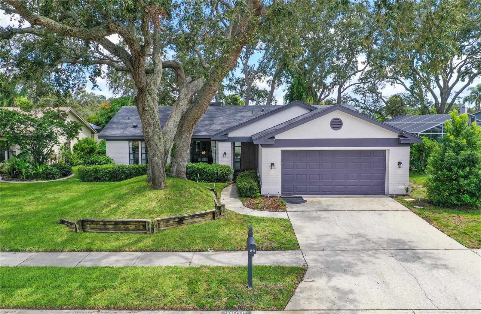 Welcome to 2906 Windridge Drive, just north of Tarpon Springs, where peace of mind meets luxury living. This stunning waterfront dream home is proudly situated in a non-flood zone, ensuring that flood insurance is not required. This feature, combined with the home’s elevated position, offers unrivaled security and stability, even through recent storms. Located in the prestigious Gulf Trace community, this home is perfectly nestled between the charming Tarpon Springs and the up-and-coming New Port Richey, placing you just 10 minutes from all the excitement and amenities of New Port Richey. Enjoy being around the corner from some of the area's best seafood and waterfront culinary experiences. Plus, you're only 2 miles from the serene Key Vista Gulf Front Nature Park and the breathtaking Gulf of America. This Rutenburg-built masterpiece offers million-dollar views over a pristine lakefront lot—one of the best in the neighborhood. With 3 bedrooms and 2 bathrooms, the home boasts a remodeled and thoughtfully designed layout that balances cozy vibes with luxury finishes. Custom interior and exterior paint, designer lighting with dimmer switches, and attention to every detail elevate the space, making it the ideal retreat. Wake up every morning to amazing sunrise views from your waterfront haven, while enjoying the wildlife-filled surroundings—including peacocks, turkeys, cranes, ducks, and even rare white peacocks—creating a truly tranquil and picturesque environment. From the high and dry lot to the thoughtfully designed living spaces, 2906 Windridge Drive offers a safe, elevated lifestyle with all the comforts and stunning views you deserve. This is a rare opportunity to own a piece of paradise where luxury, location, and peace of mind come together seamlessly.