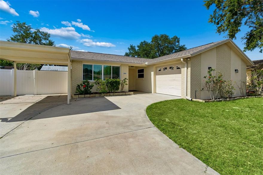 One or more photo(s) has been virtually staged. Welcome to this well maintained 3 bedroom, 2 bathroom POOL HOME with a 1 car garage and additional 1 car carport, offering 1,238 heated square feet and a spacious, functional floor plan perfect for everyday living and entertaining. Inside, vaulted ceilings make the main living area feel bright, wide open, and inviting, while the layout offers two separate living spaces including a comfortable Florida room overlooking the backyard and pool area, creating flexibility for entertaining, relaxing, or a home office setup. The primary suite serves as a true retreat with its own connected en suite bathroom, while the additional two bedrooms are generously sized and share a second full bathroom nearby. The home also offers a seamless indoor/outdoor flow with an expansive covered lanai and screened enclosure surrounding the large sparkling pool, making it ideal for enjoying the Florida lifestyle year round. Outside, the oversized driveway provides plenty of parking in addition to the garage and carport, while the fully vinyl fenced backyard offers privacy along with a convenient storage shed. Numerous updates have been completed over the years including a 2024 roof, updated windows in 2013, PVC replumbing, owned water softener, and a recently serviced Trane AC system. Conveniently located in the heart of Town N Country, this home is close to Tampa International Airport, downtown Tampa, major highways, shopping, restaurants, entertainment, and all that the Tampa Bay area has to offer. Make your appointment today!