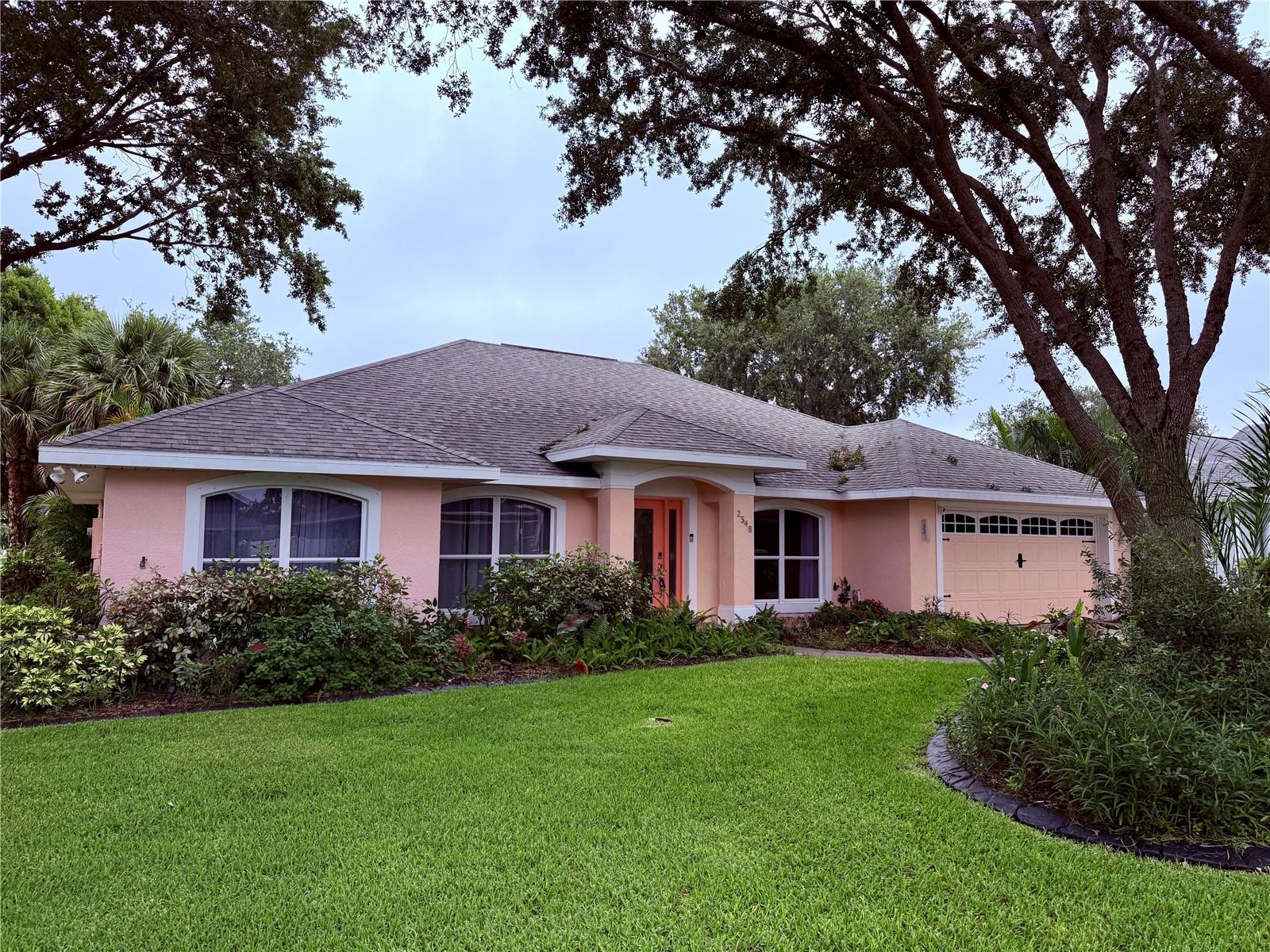 This exquisite home offers four bedrooms, complemented by two bathrooms and over 1,900 square feet of living area. Nestled within a gated community on a corner lot, the property is adorned with mature landscaping and stunning oak trees. The interior features vaulted ceilings and an open floor plan, while the spacious kitchen showcases wood cabinets with soft-close drawers, pullouts, solid surface countertops, and sleek black stainless steel appliances. The master suite is a true retreat, complete with a walk-in closet and a luxurious bathroom featuring double sinks, a shower, and a separate tub. Additional highlights include built-in cabinets, window treatments, oversized windows that flood the space with natural light, tall baseboards, and a triple slider leading to a large covered screened porch. The home also boasts a two-car garage, indoor laundry, a tankless hot water system, and a whole-house generator. This property is in excellent condition and awaits its new owner—schedule a viewing today!